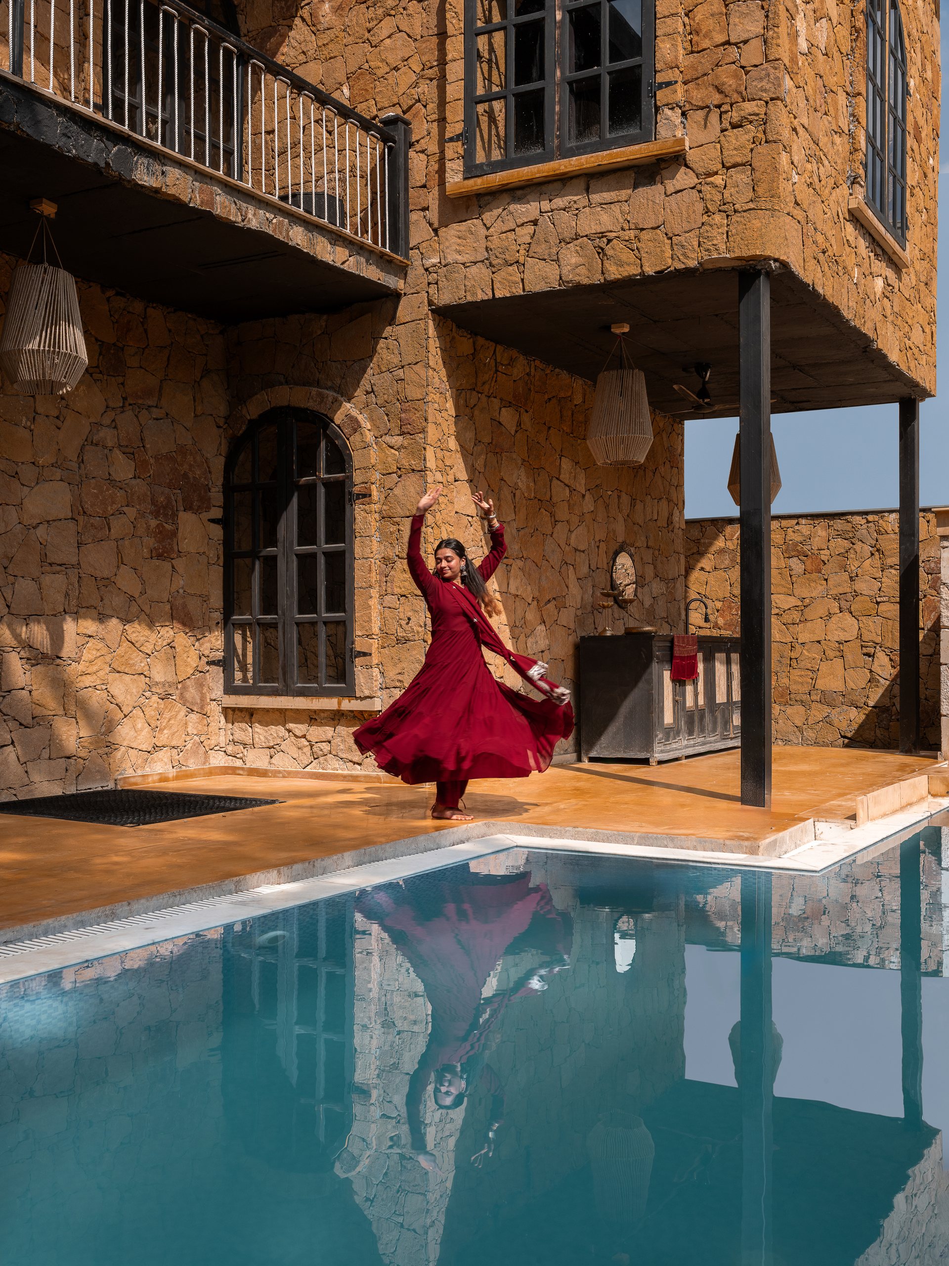 Swimming pool beside Vedalila sandstone facade