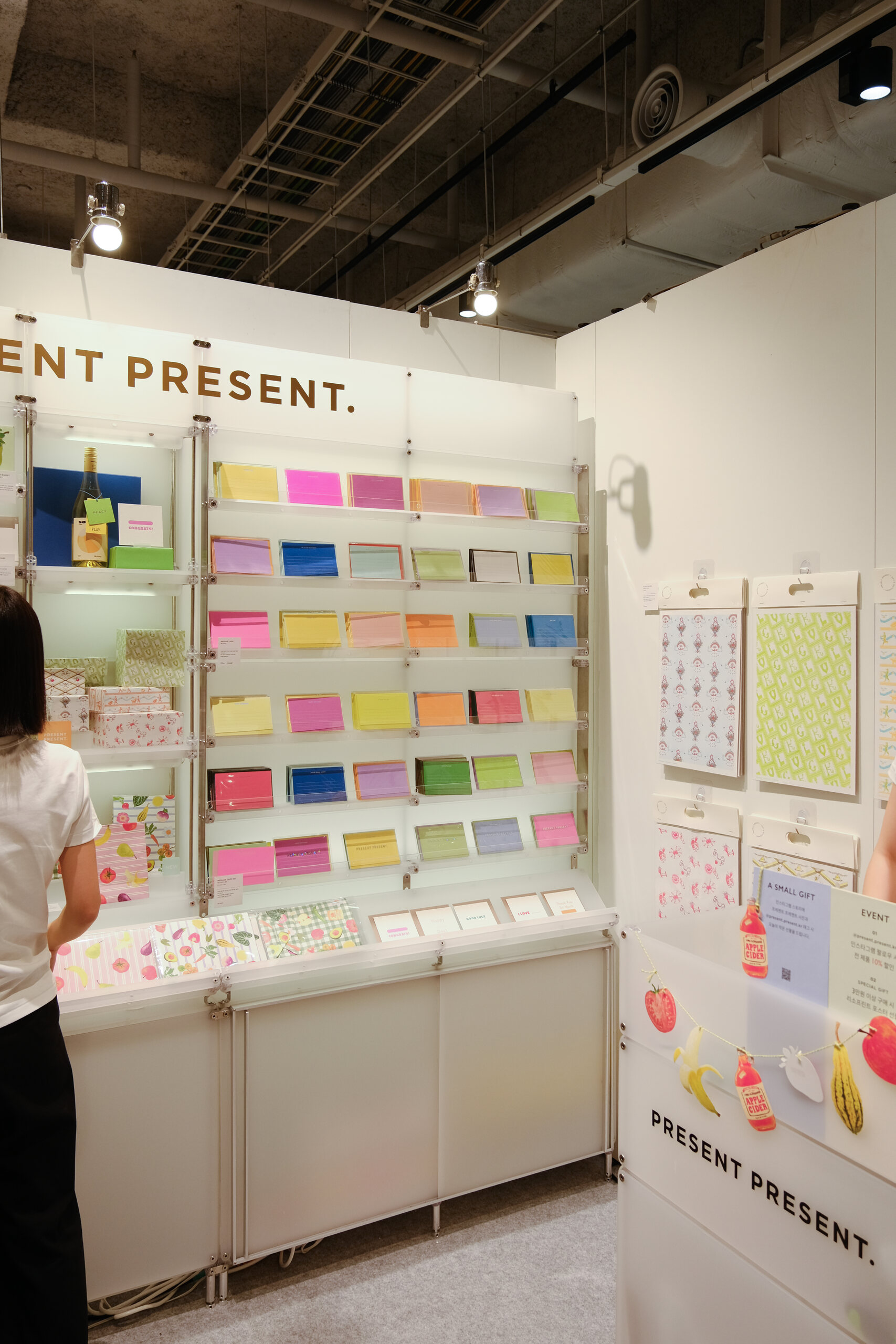 Wall mounted stationery displays inside the PRESENT PRESENT booth