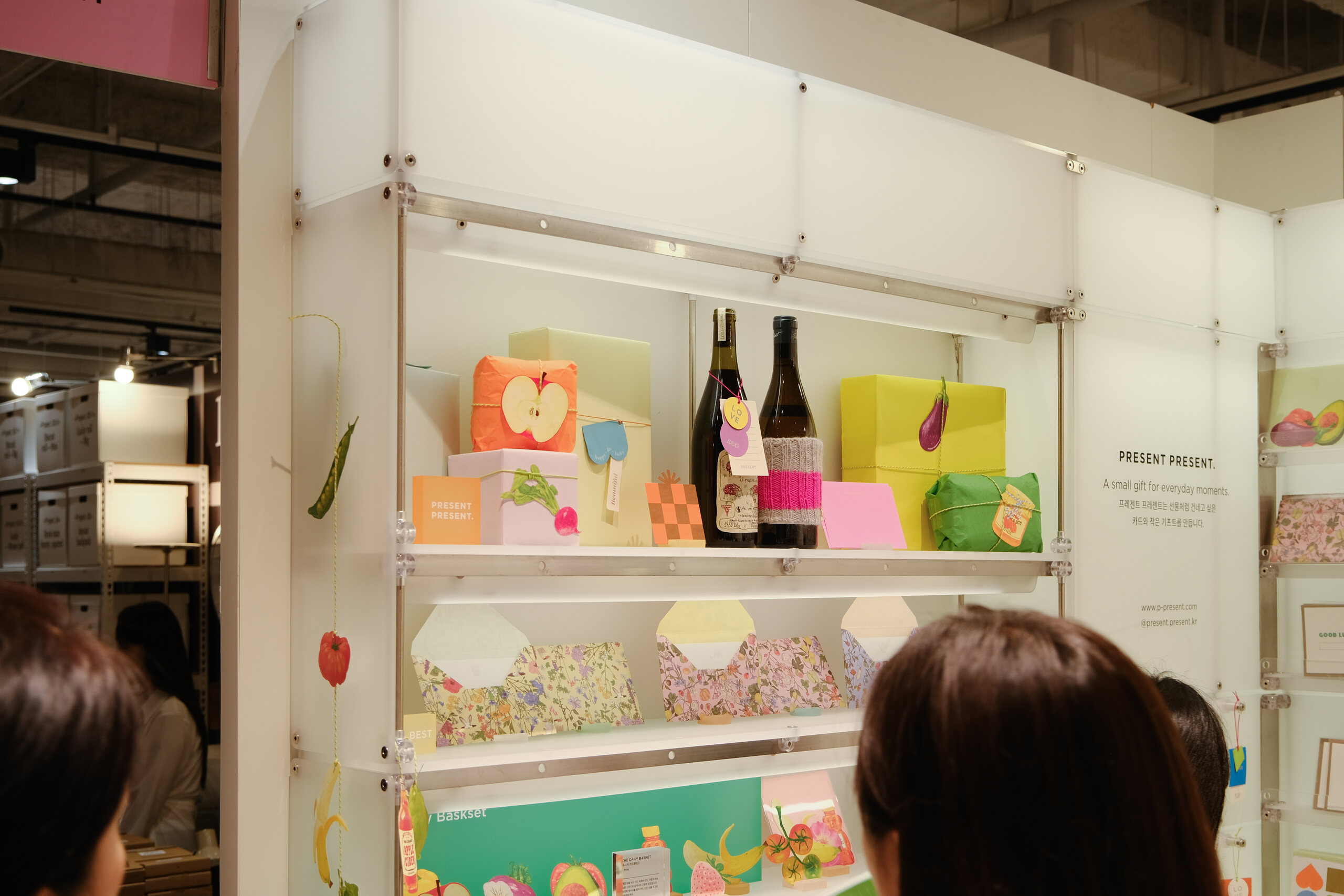 Colourful gifts arranged on translucent white shelves