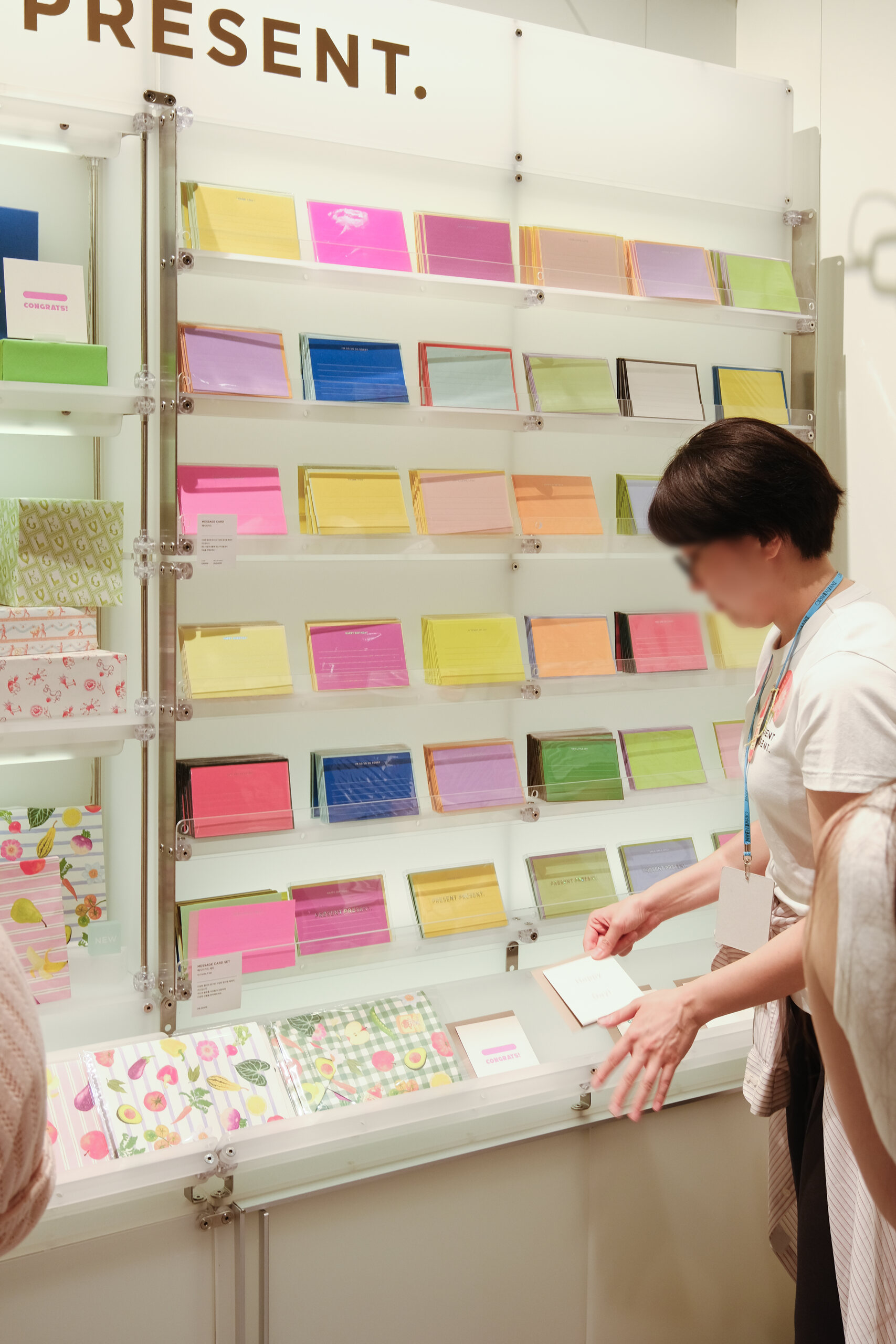 Stationery arranged by colour within the vertical display system