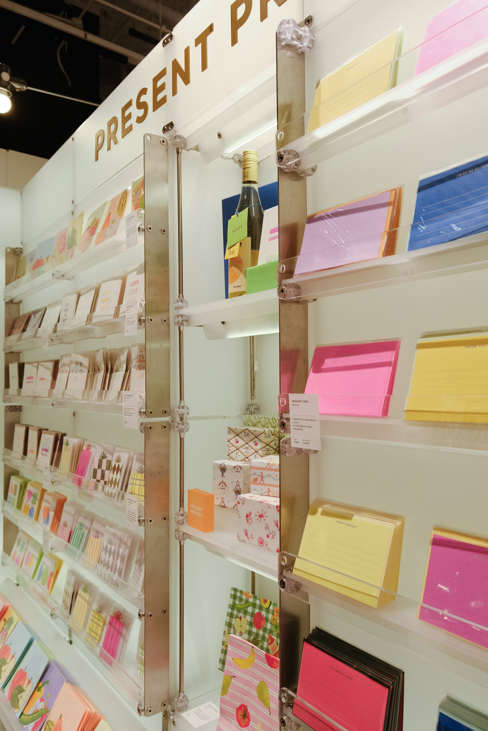 Modular wall fixtures filled with colourful stationery