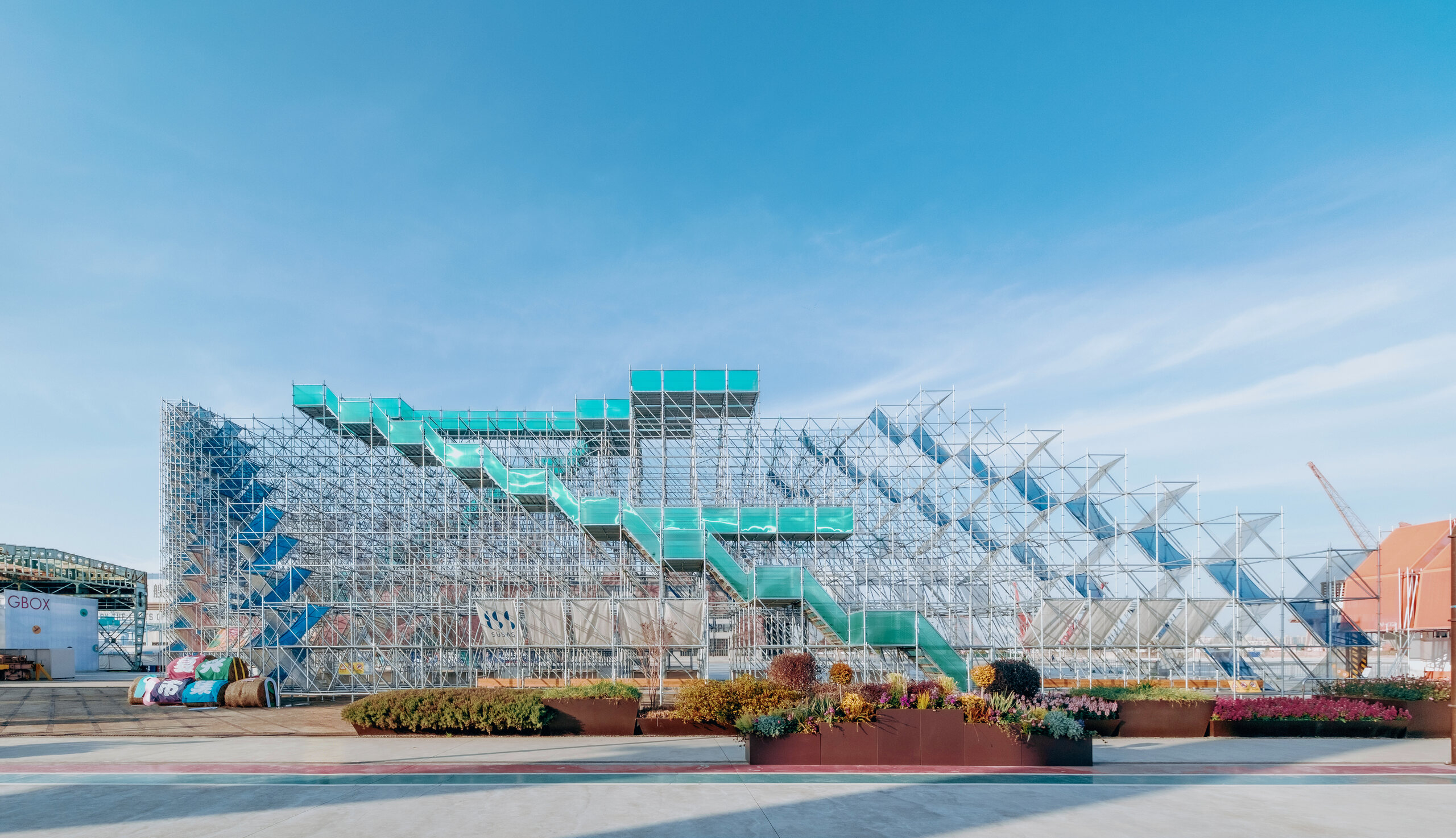 South facade of Mount Bazaar with blue membranes and scaffolding