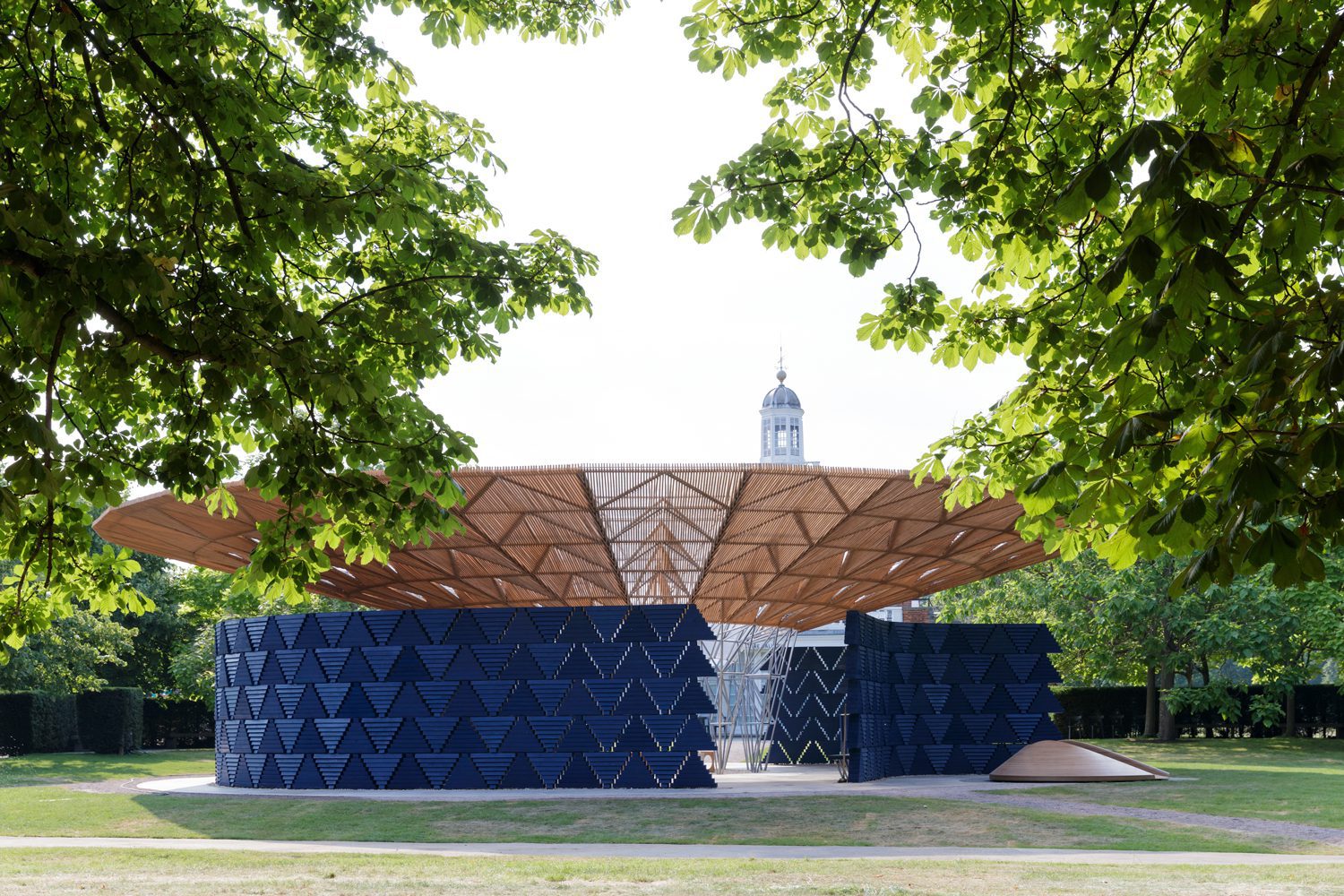Francis Kéré’s broad canopy provides shade and shelter while recalling a tree as a shared meeting point. © Kéré Architecture; photograph by Iwan Baan.