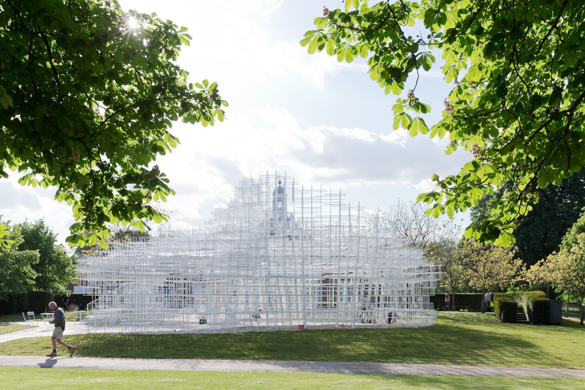 Sou Fujimoto’s lightweight, semi-transparent structure blends into the landscape like a cloud. © Sou Fujimoto Architects; photograph by Iwan Baan.