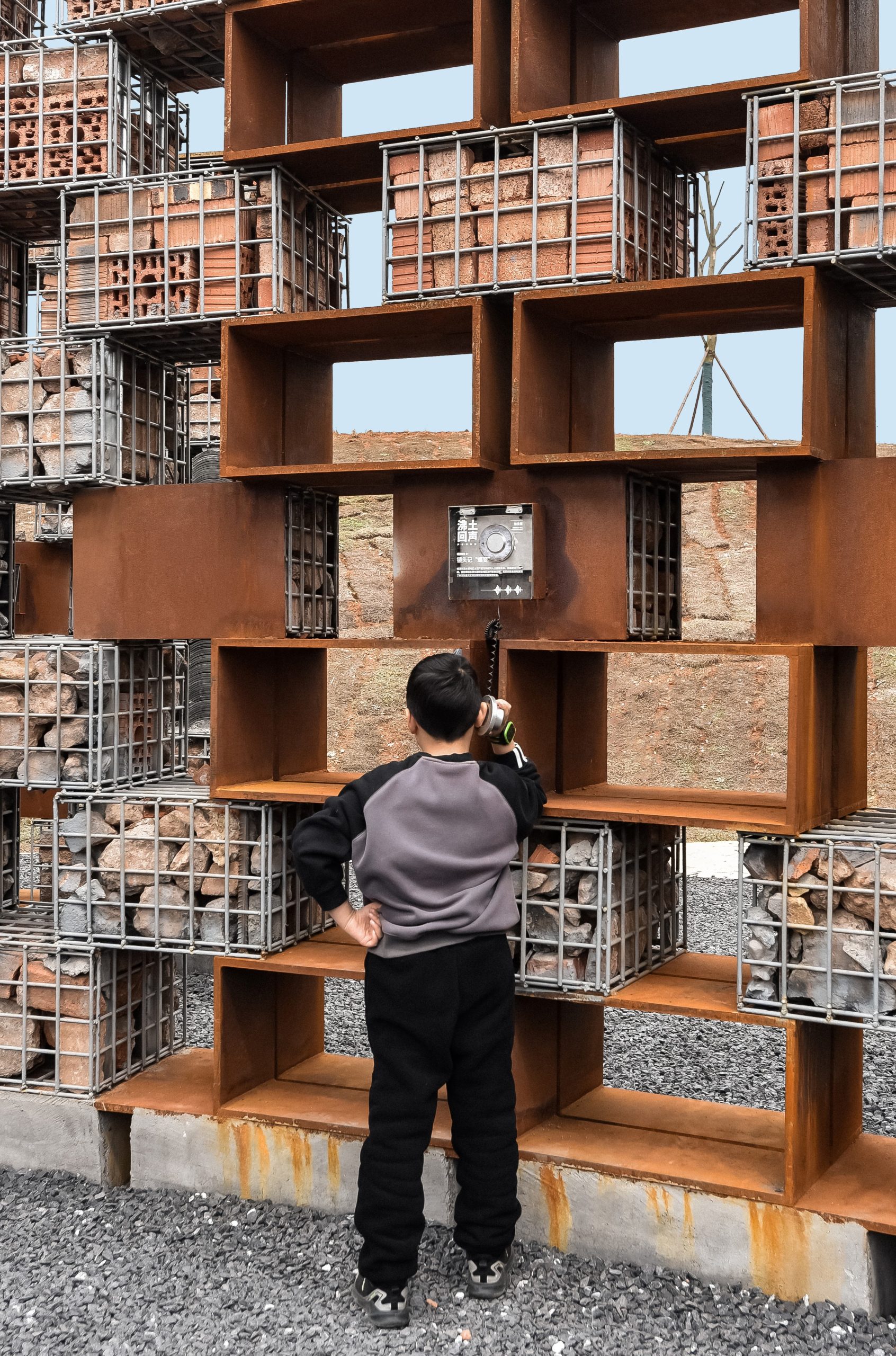 A young visitor listens to the museum’s sound archive