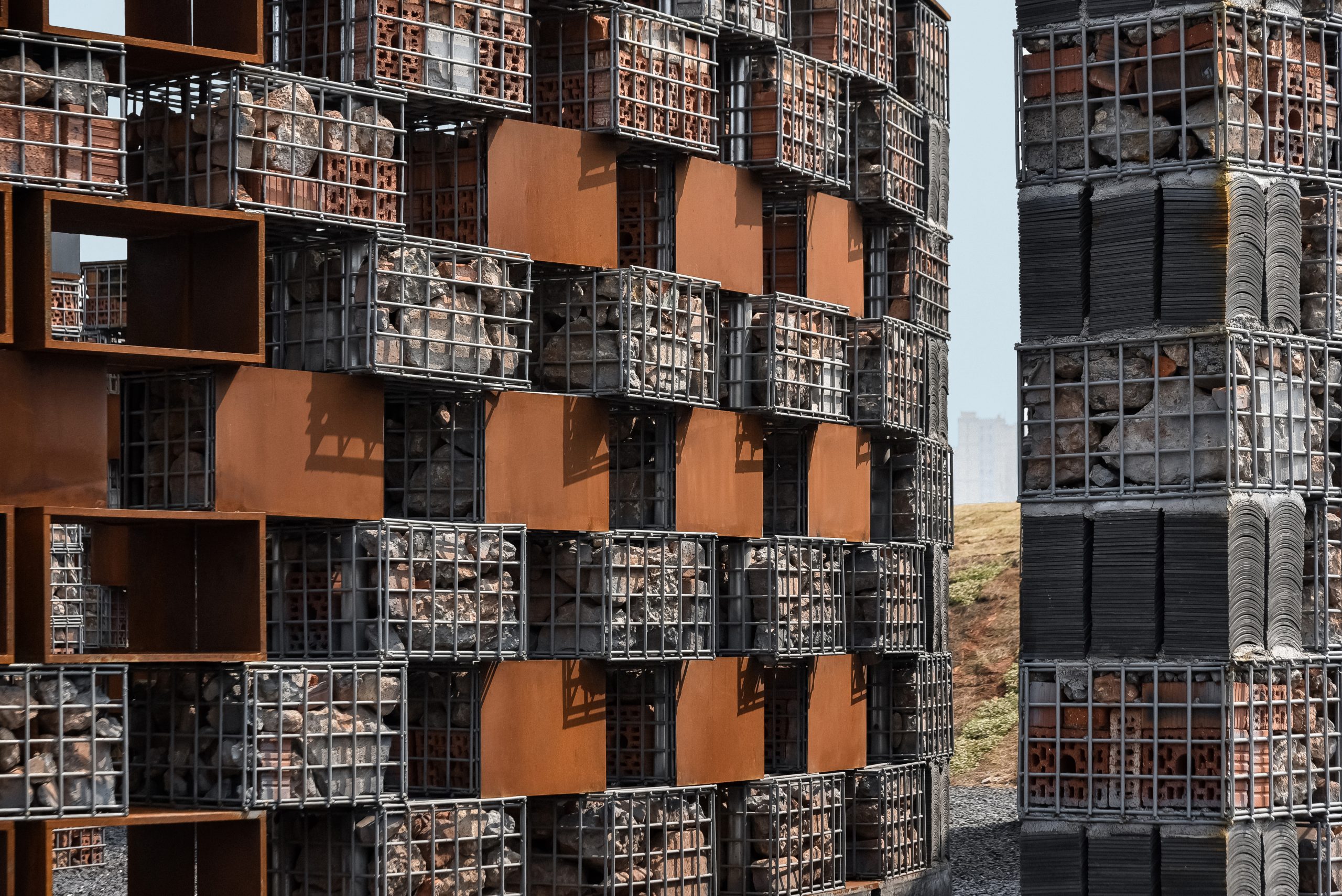Detail of the museum’s brick-filled gabion facade