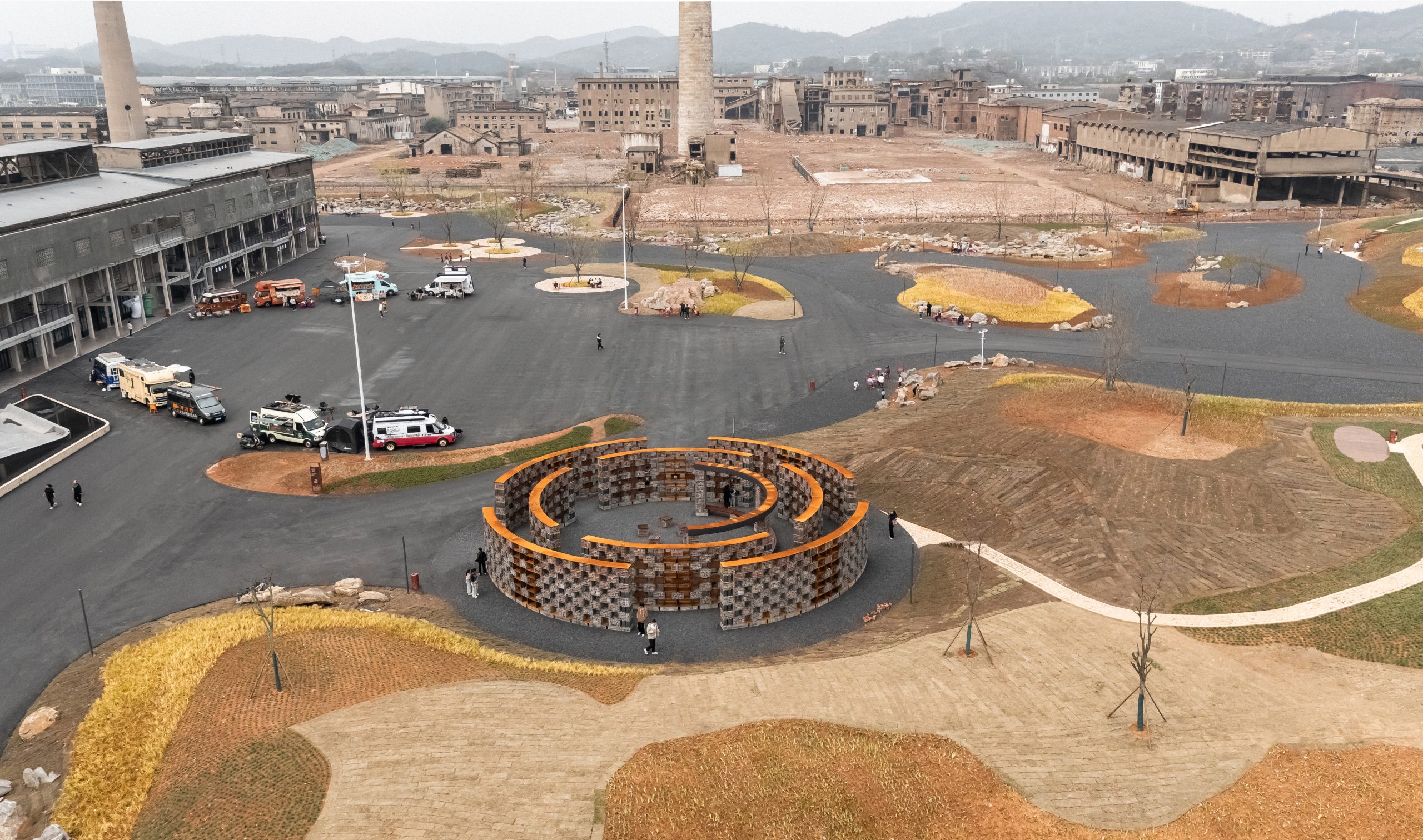 High-angle aerial view of the circular museum within the industrial heritage site