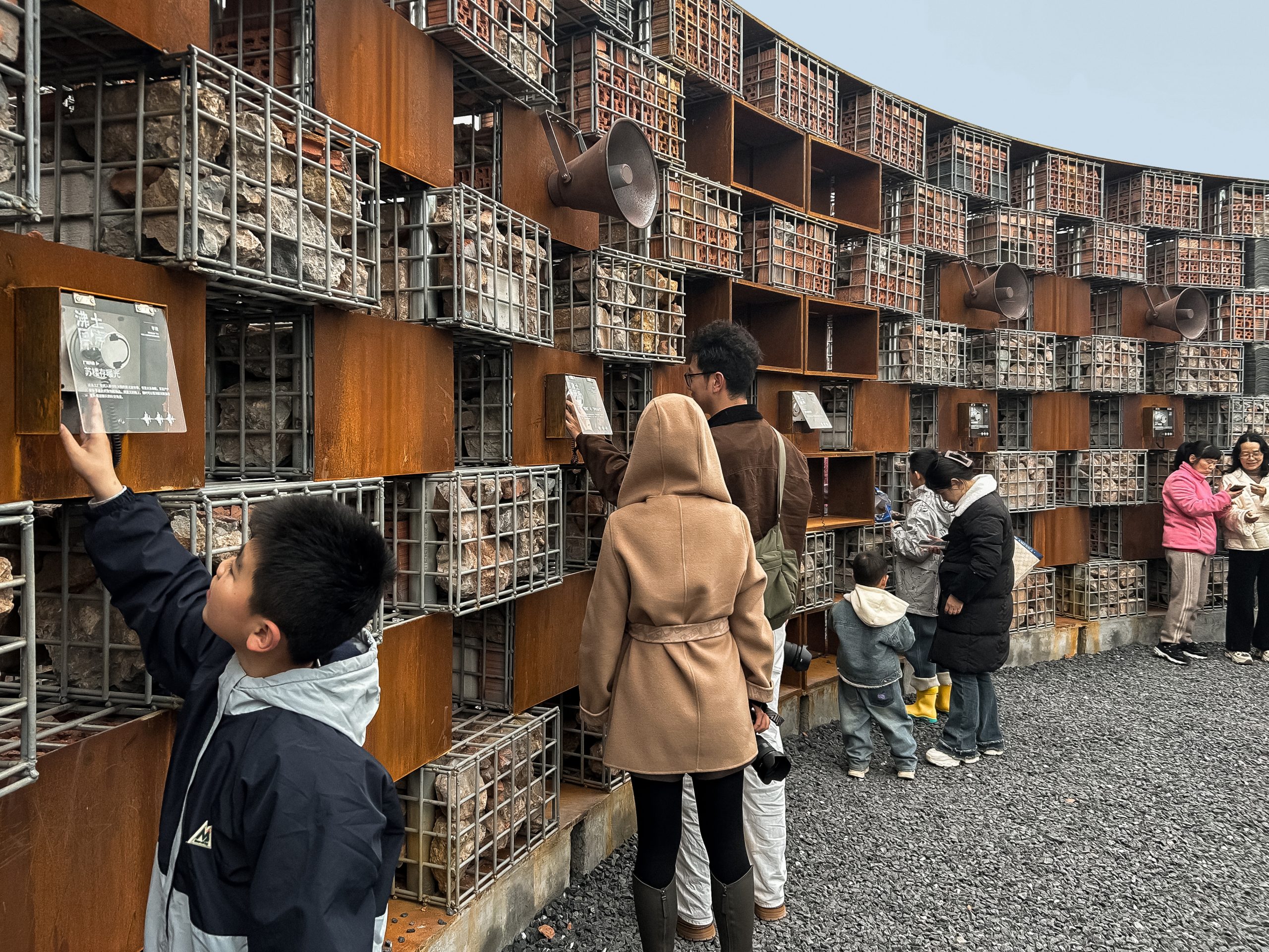 Visitors of different ages explore the open-air sound museum