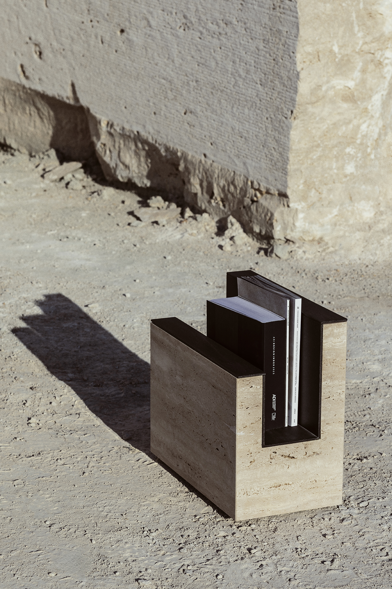 Sum travertine and metal magazine rack