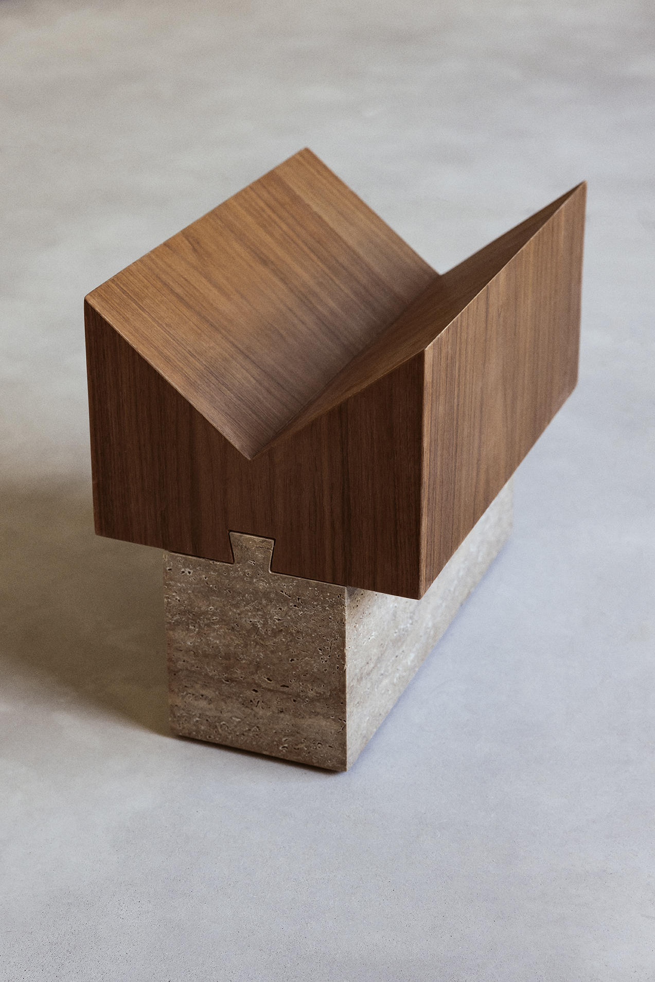 Ori travertine magazine rack with a folded upper element