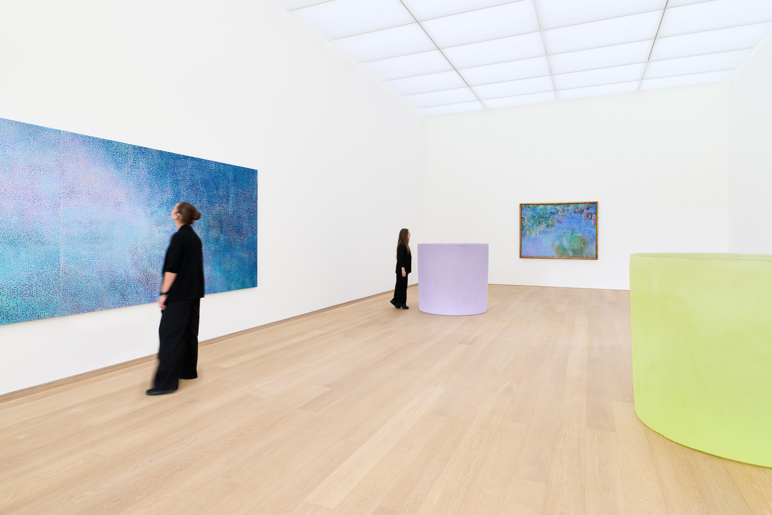 Paintings by Howardena Pindell and Claude Monet displayed with coloured glass sculptures by Roni Horn.