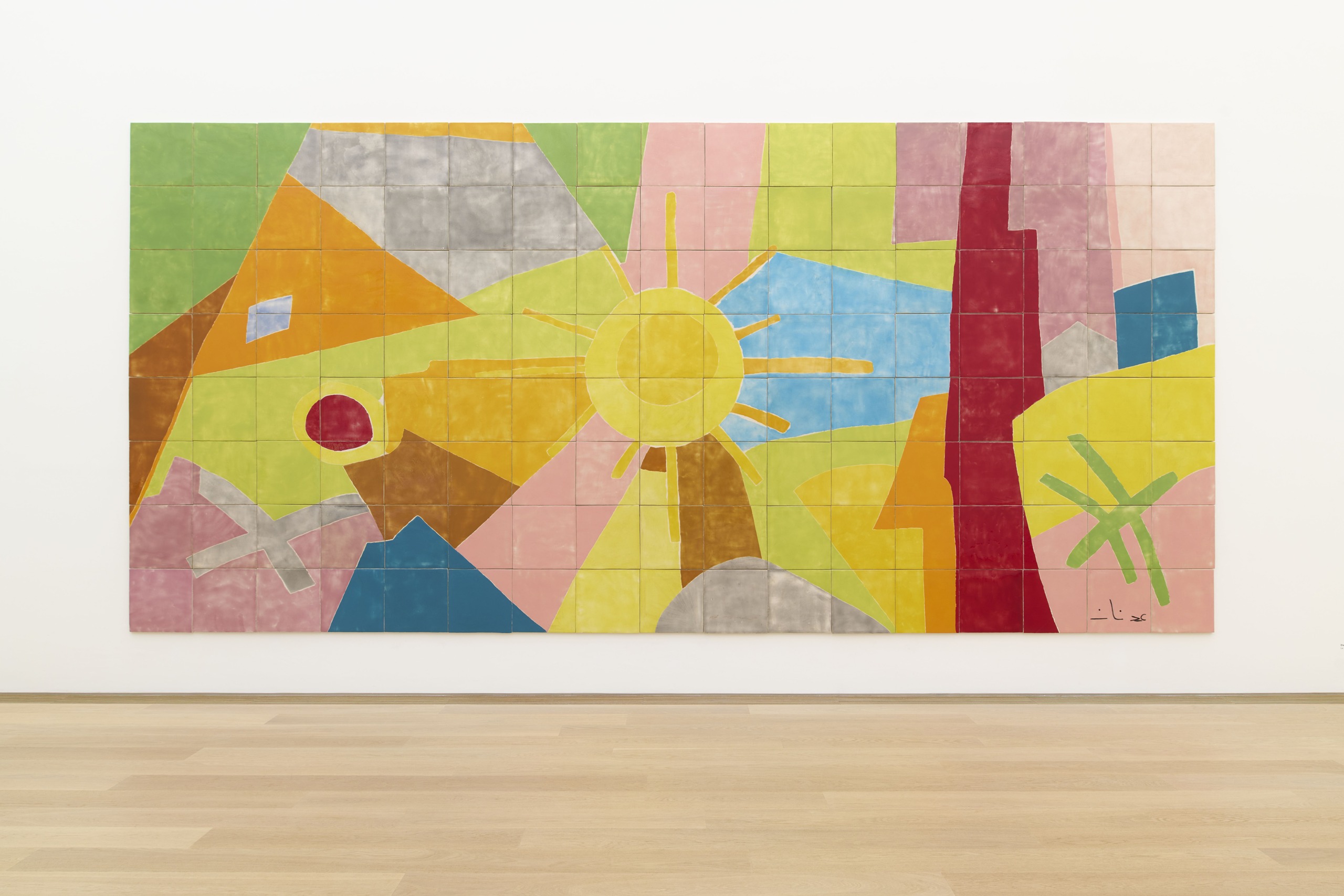 Colourful ceramic tile composition by Etel Adnan on a white gallery wall.