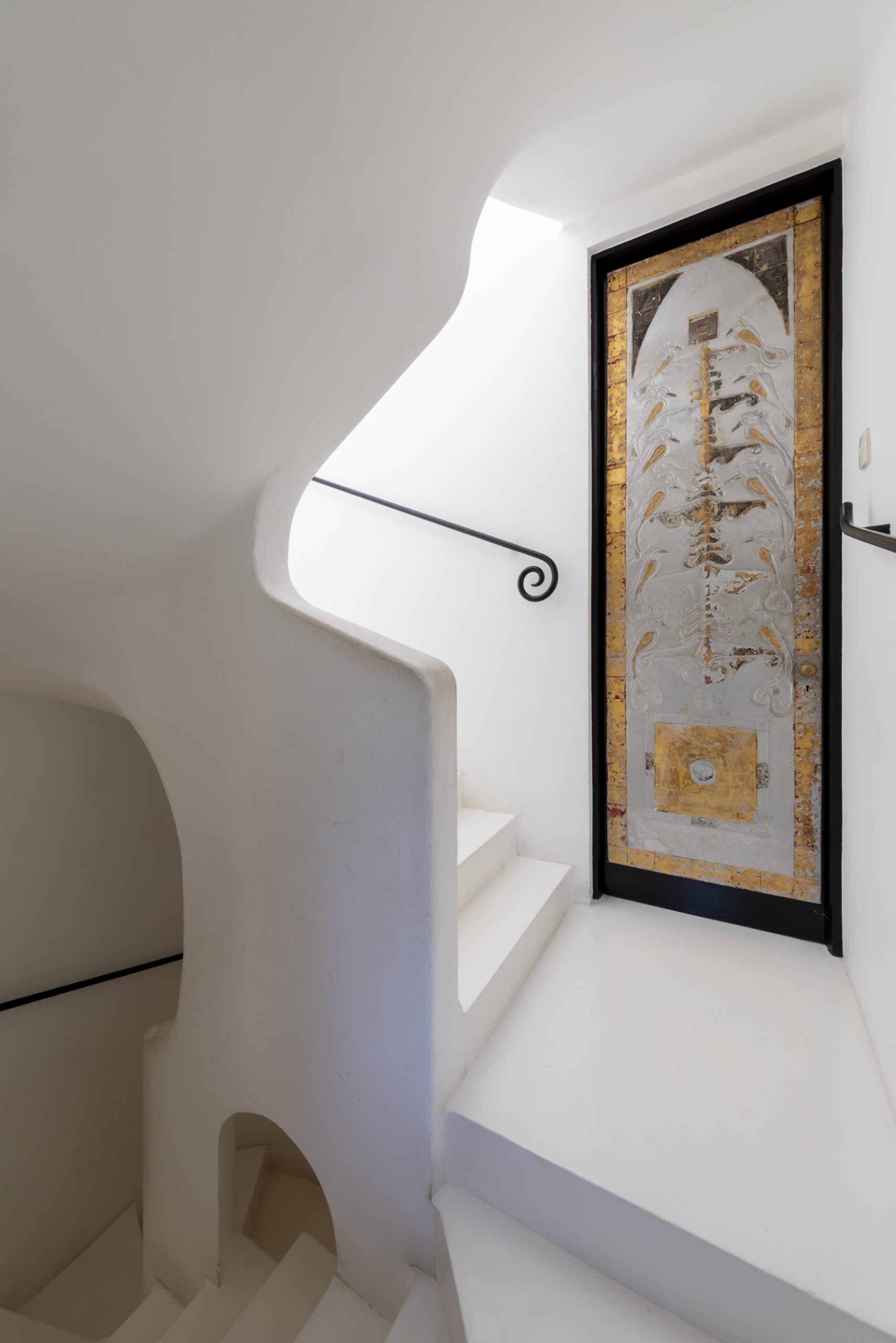 Hammered metal and gilded staircase door by Ismeth Raheem at Number 11