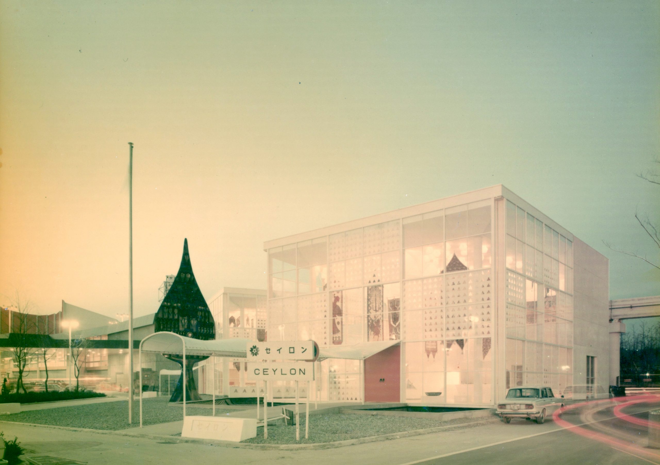 Steel and glass pavilions at Expo 70 with Laki Senanayake’s Bo Leaf sculpture