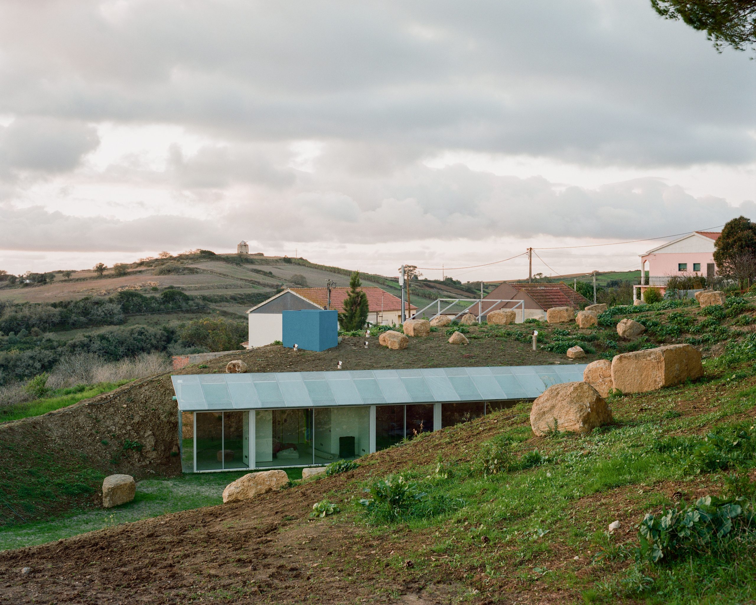 Cookie Cutter Retreat: exterior view in context relation with the landscape M building