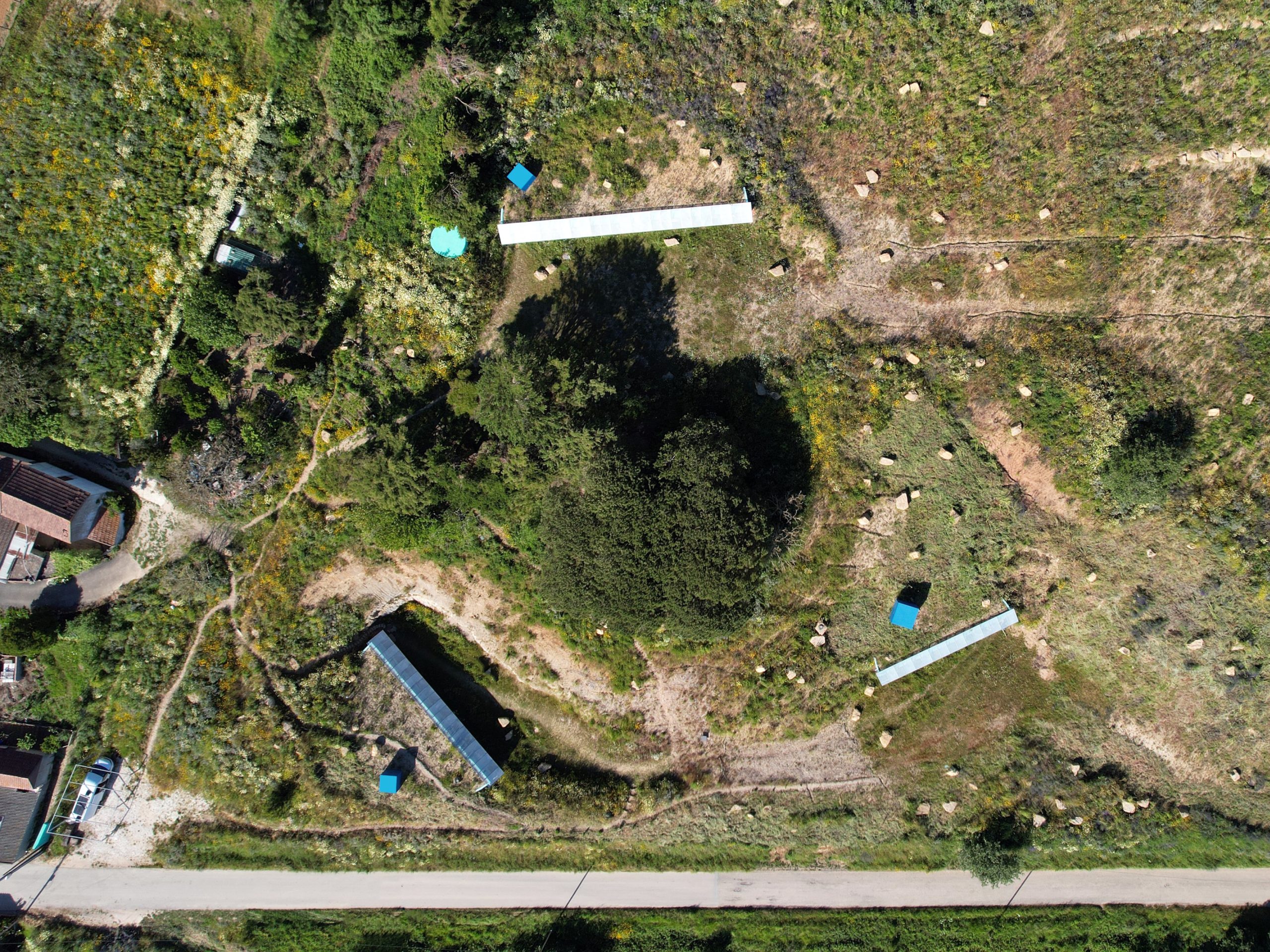 Cookie Cutter Retreat: three buildings involved by the landscape aerial view