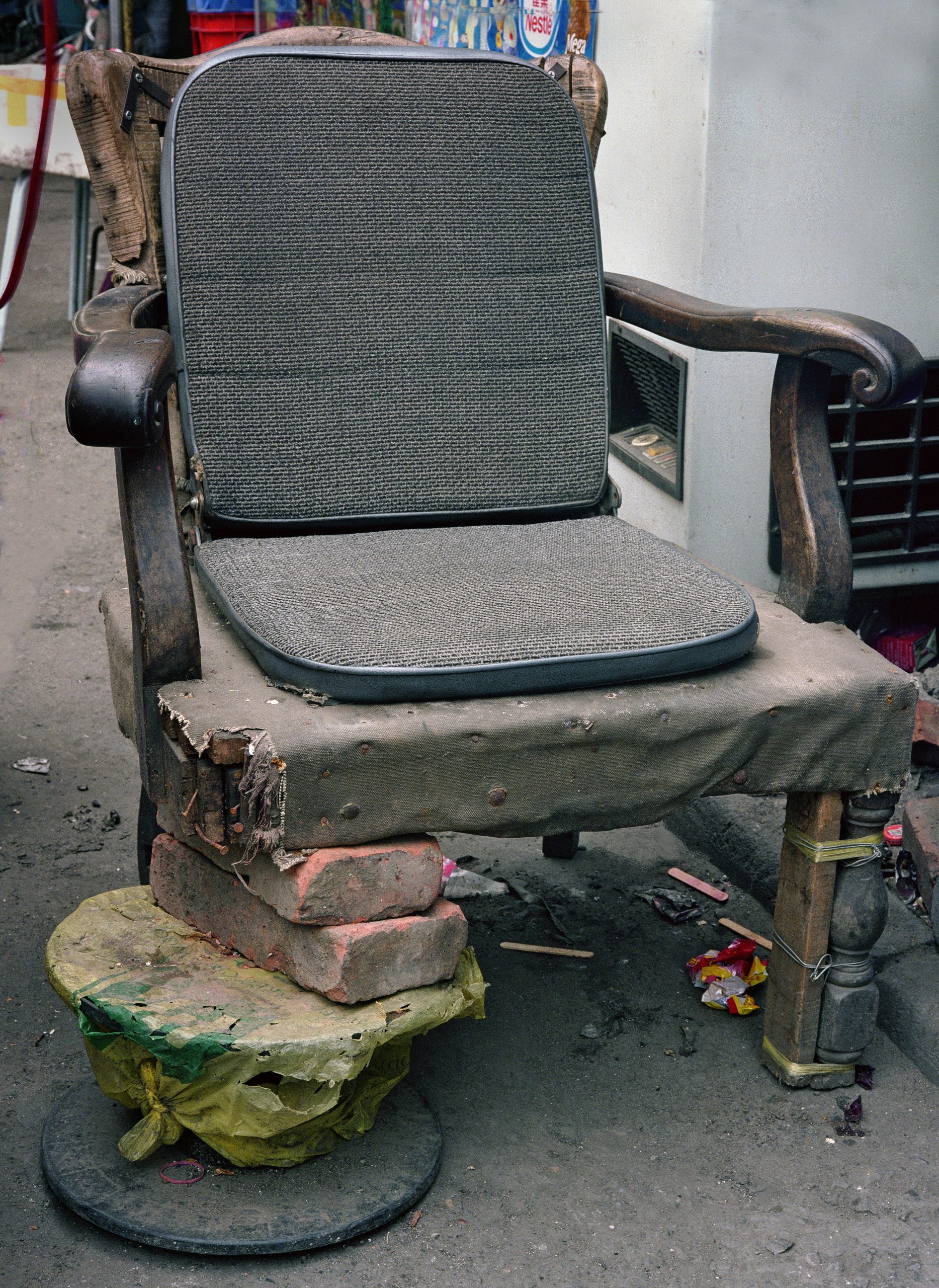 Michael Wolf, Bastard Chairs. An upholstered seat combines an altered support structure with additional props.