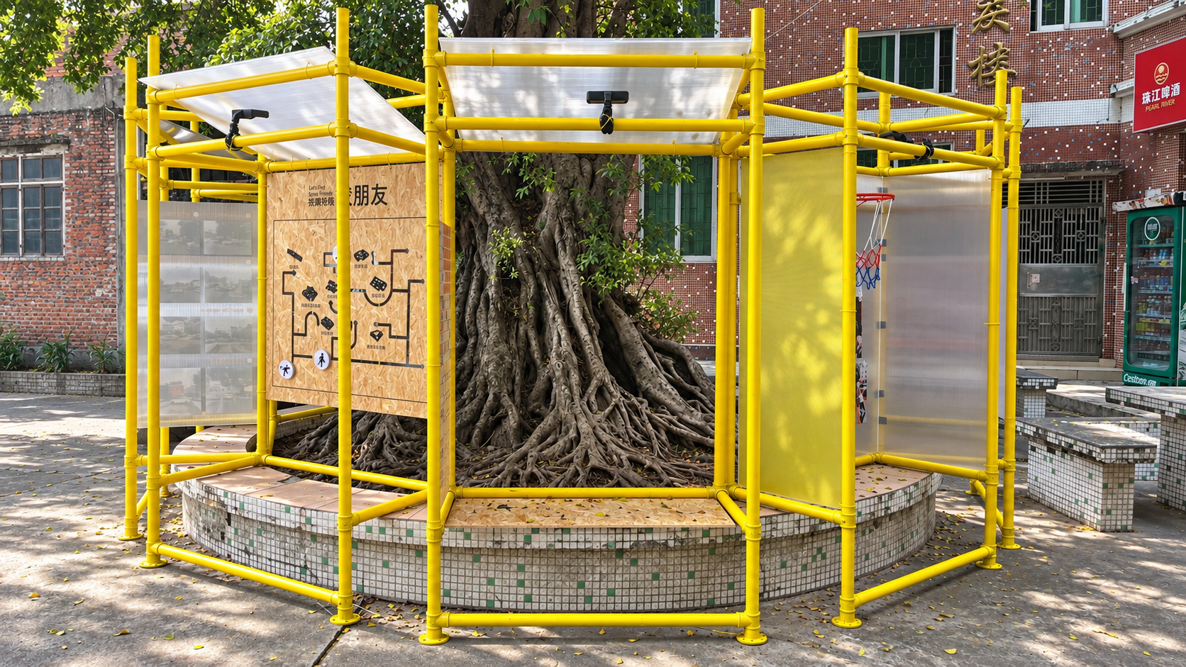Playground Beneath the Banyan Tree – Panoramic View of the Yellow Scaffolding Pavilion