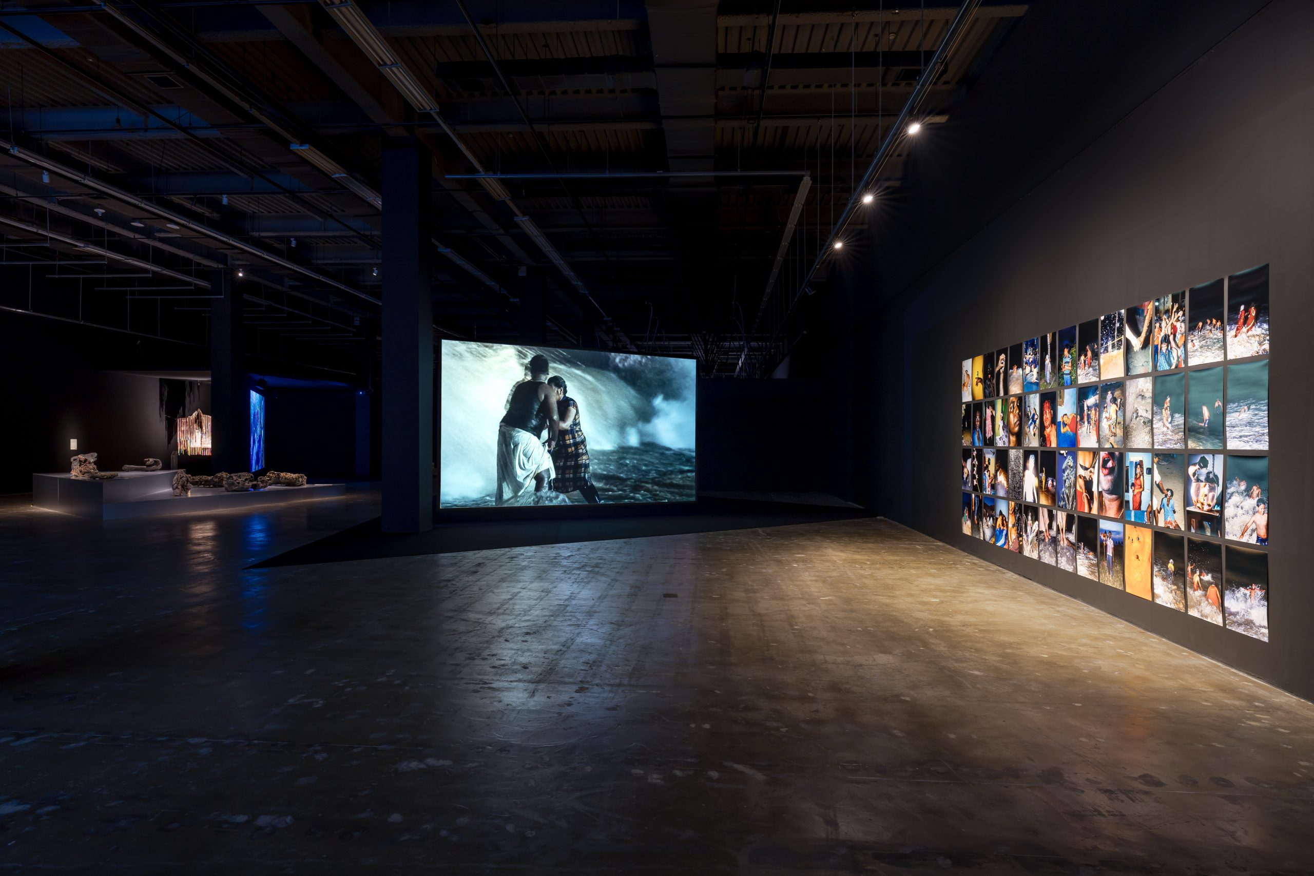 Moving-image installations in the darkened Gallery 4 of the Gwangju Biennale