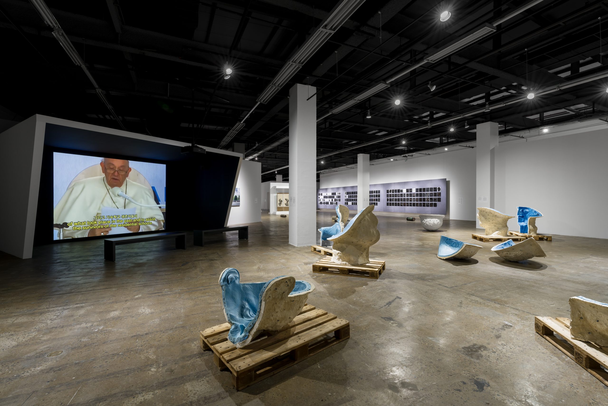 Sculptures and projected images across Gallery 3 at the Gwangju Biennale