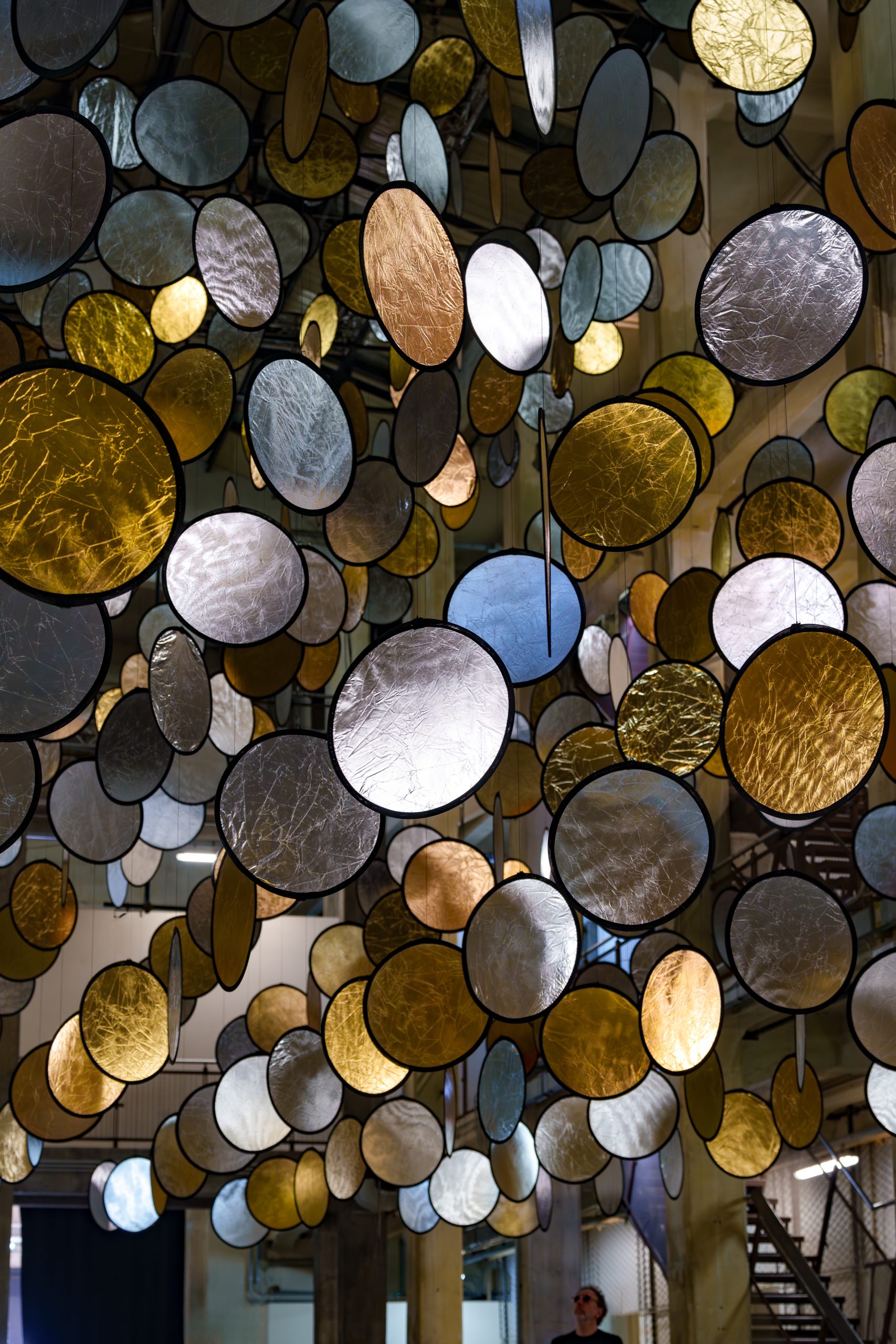 Reflective discs at different angles in SpY's kinetic installation HALOS