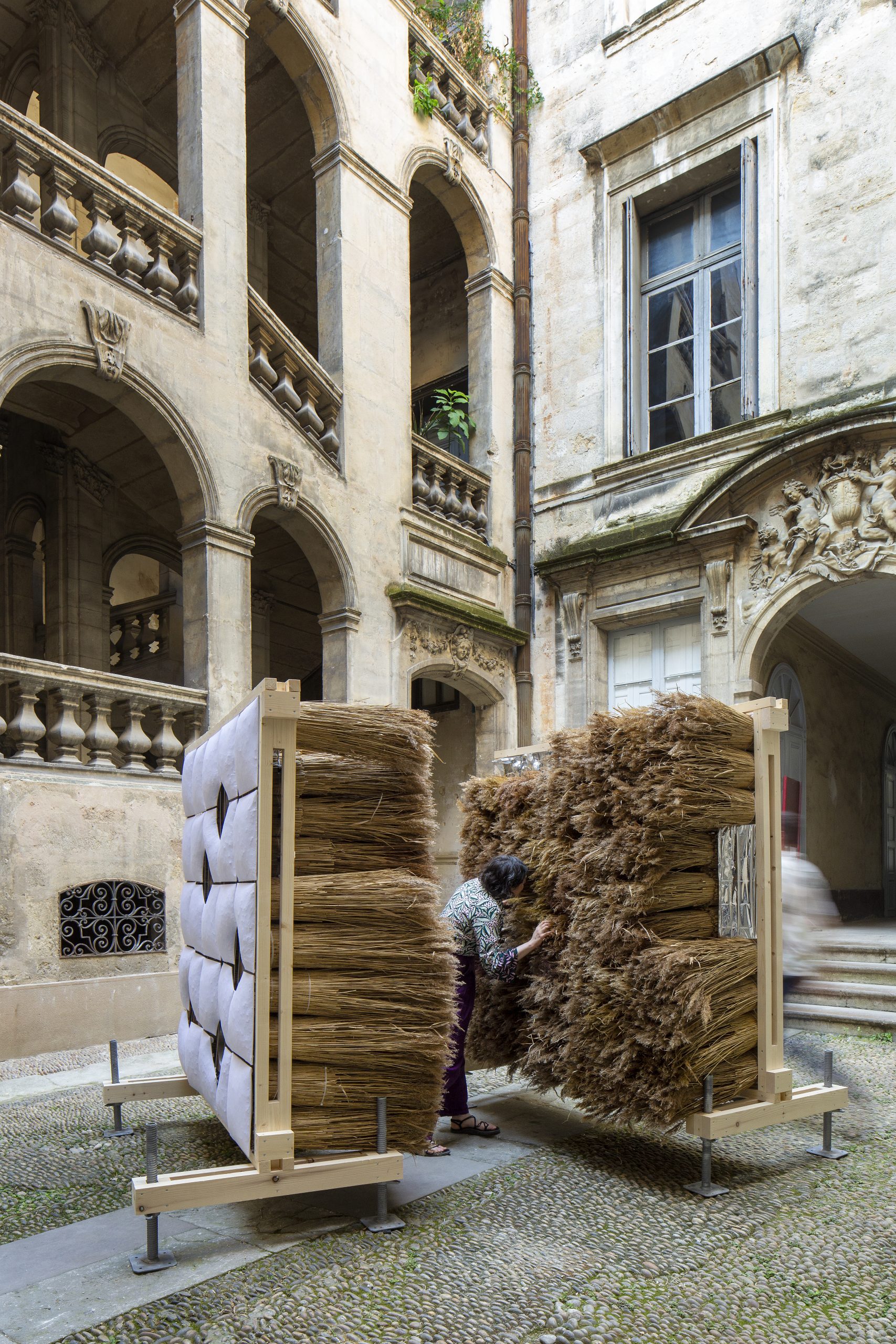 Full-height view of the timber-framed reed installation