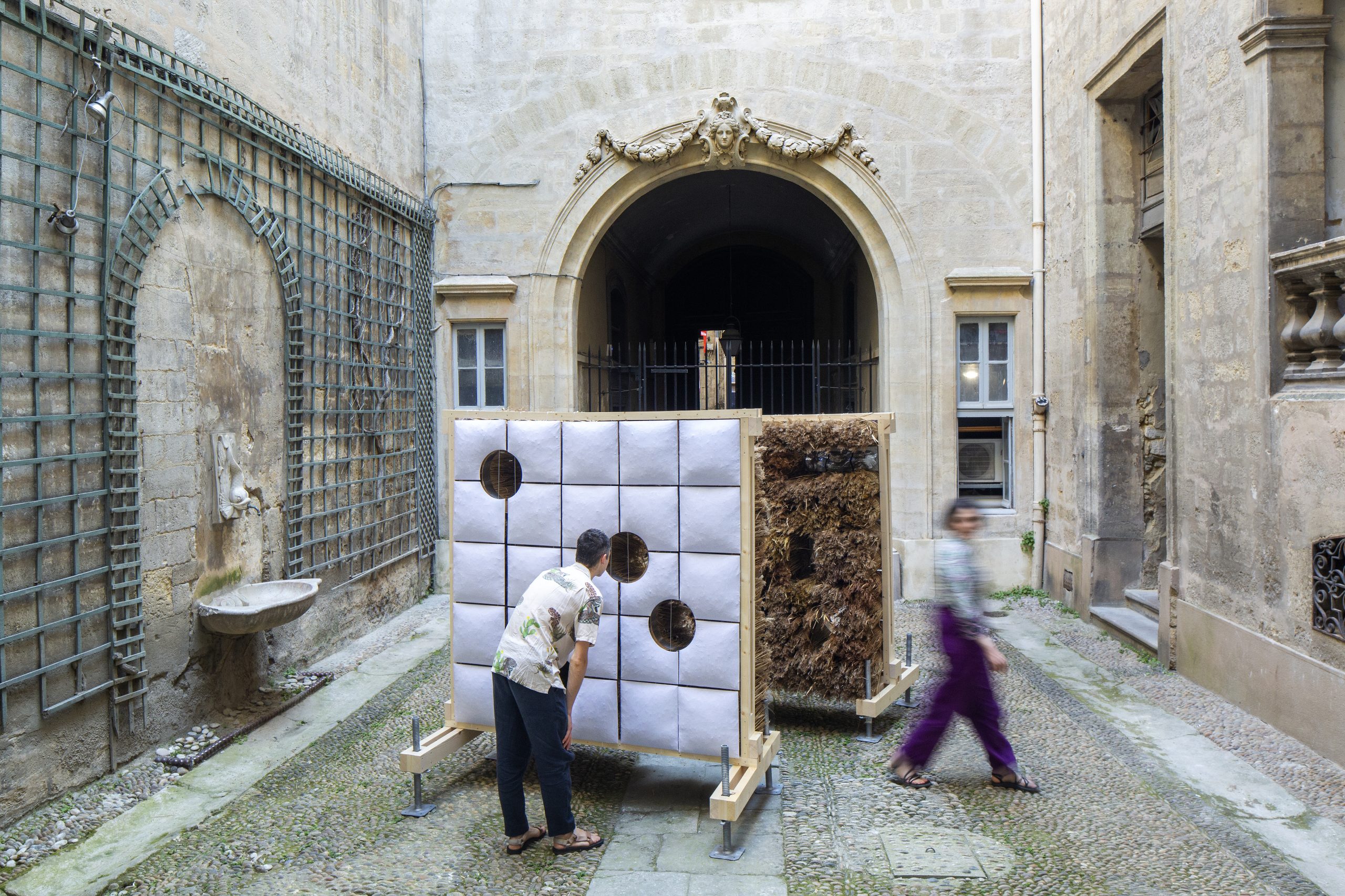 Visitors approaching the pillow-covered exterior