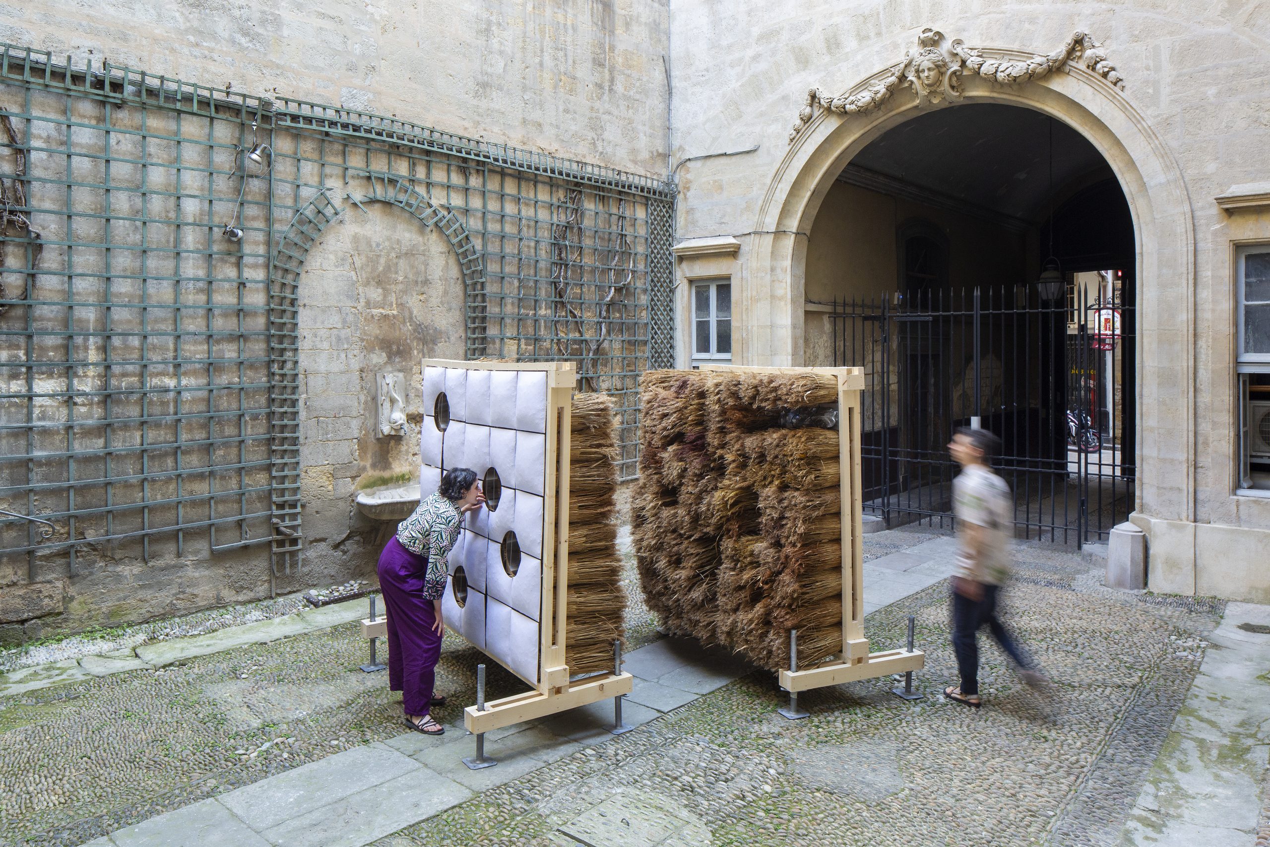 Both sides of the installation beneath the courtyard archway