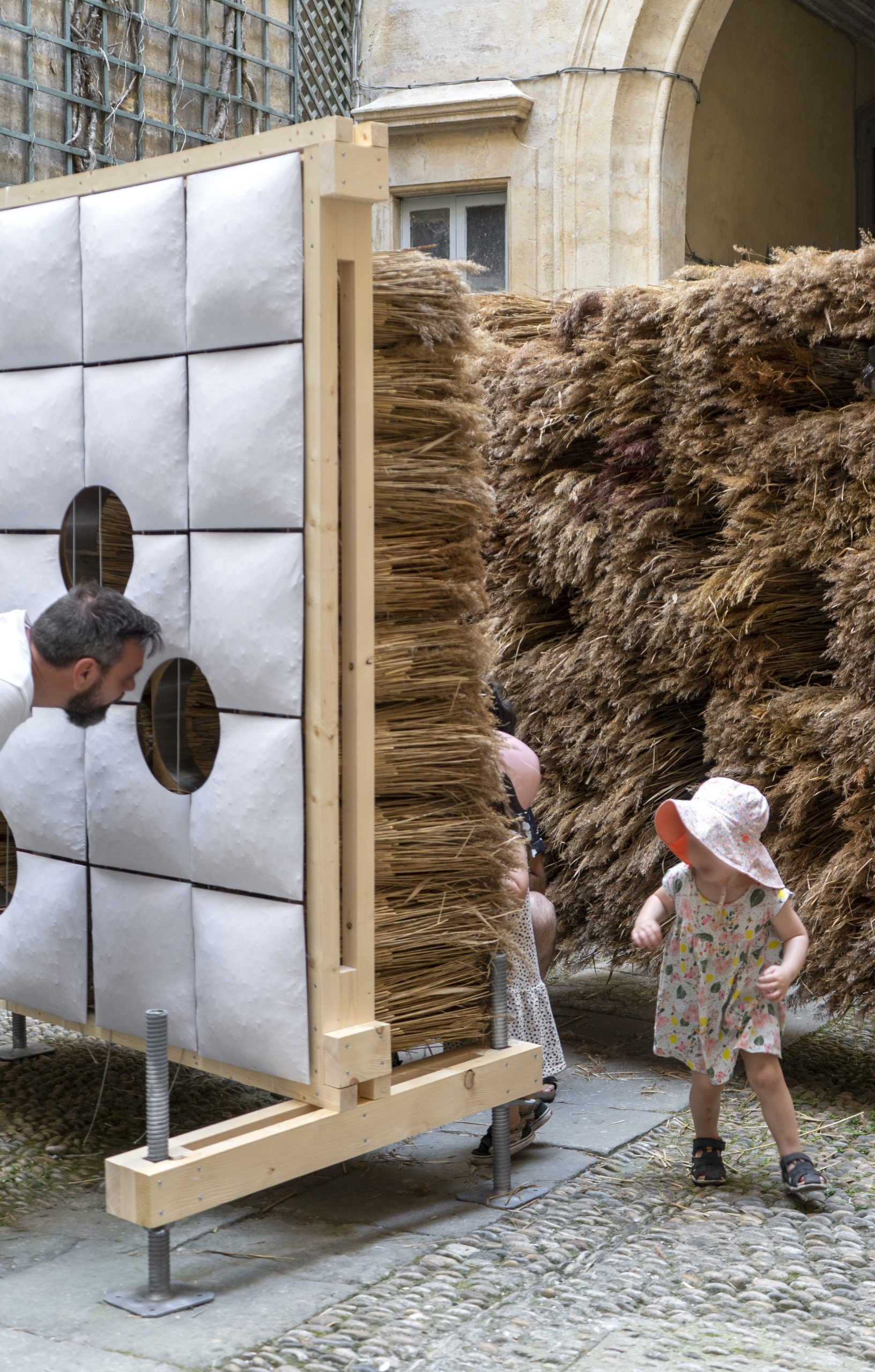 Children interacting across the two contrasting wall faces