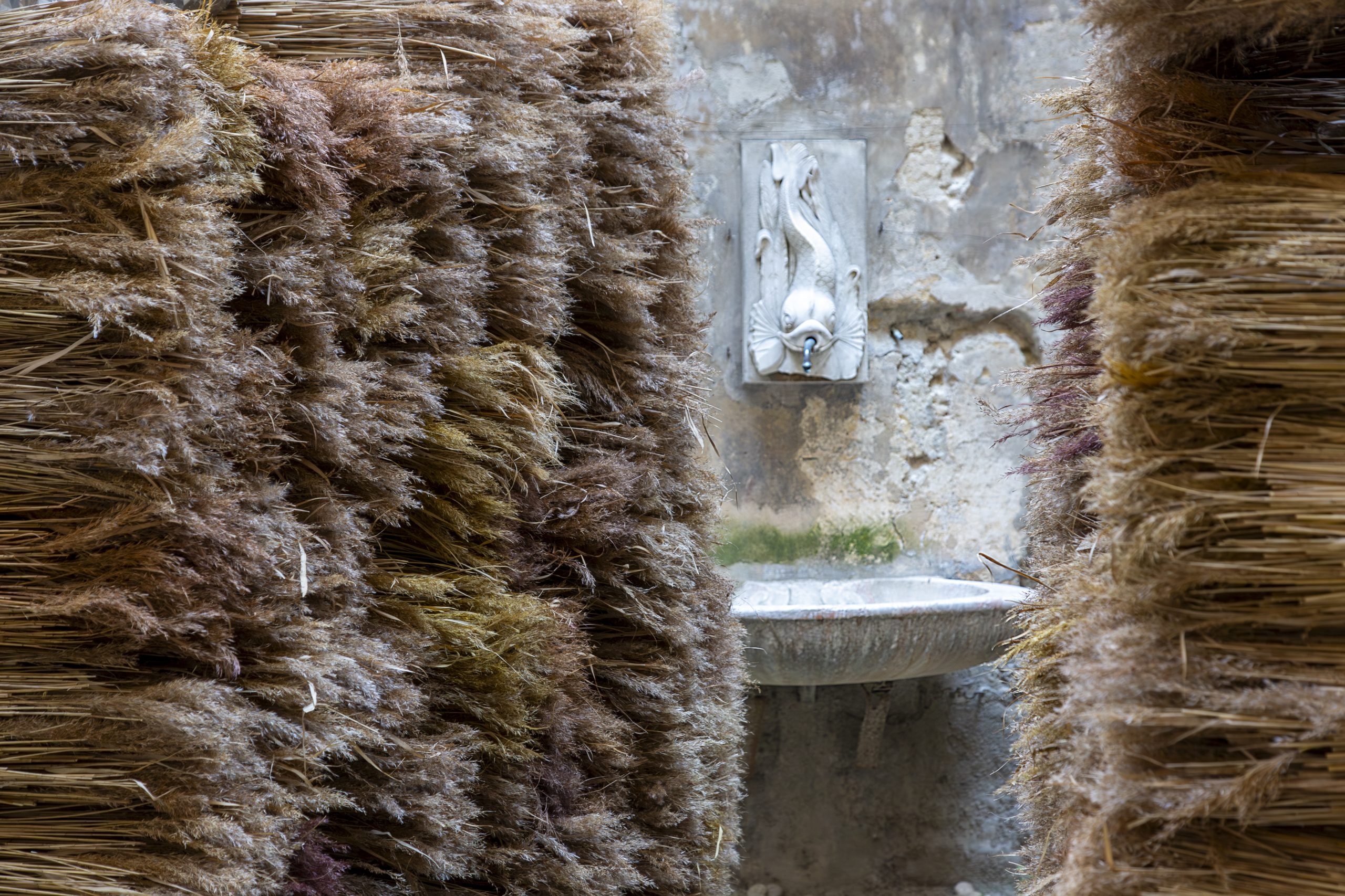 View through the reed walls towards the courtyard fountain