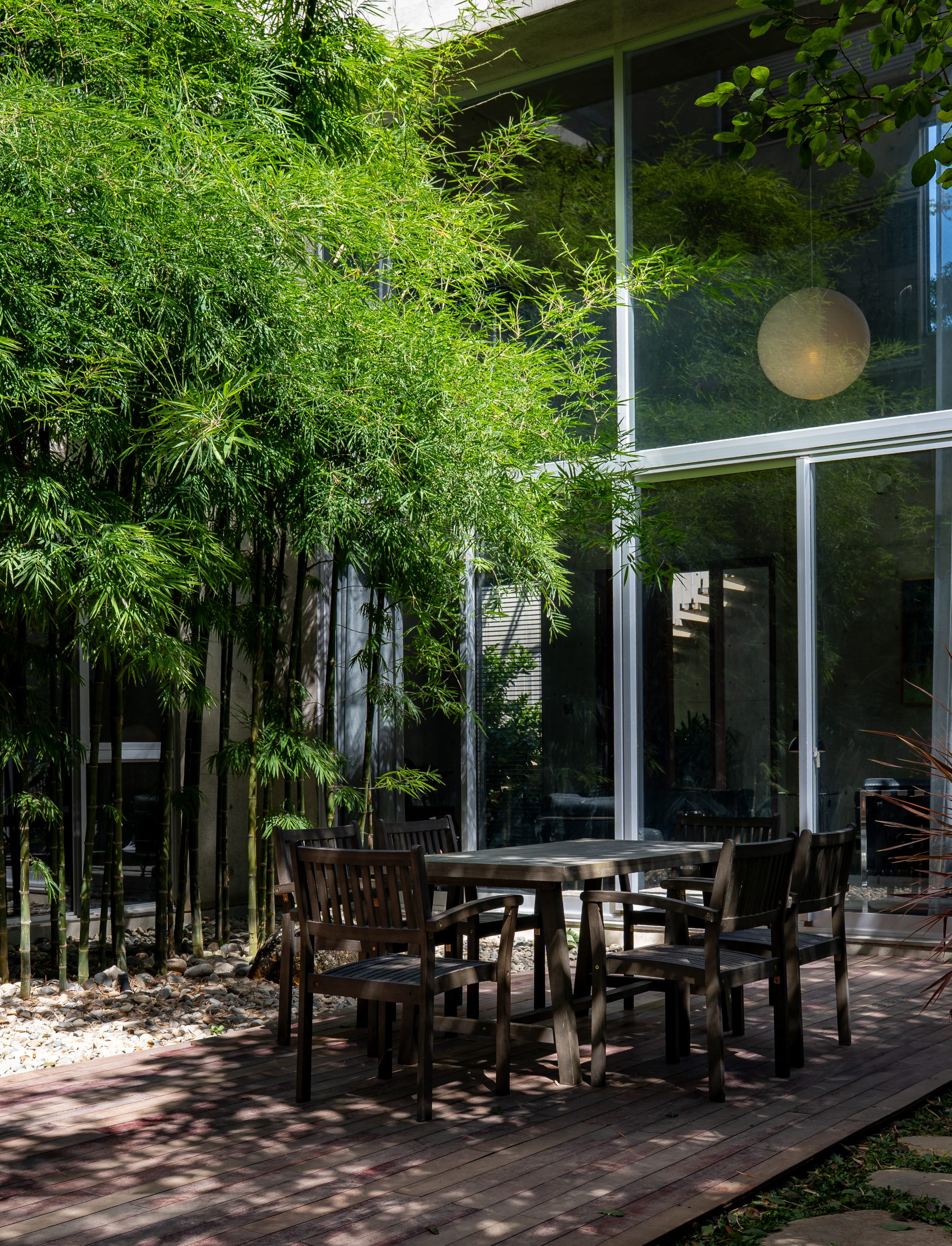 Seating beneath bamboo in the central courtyard, House K by HGAA