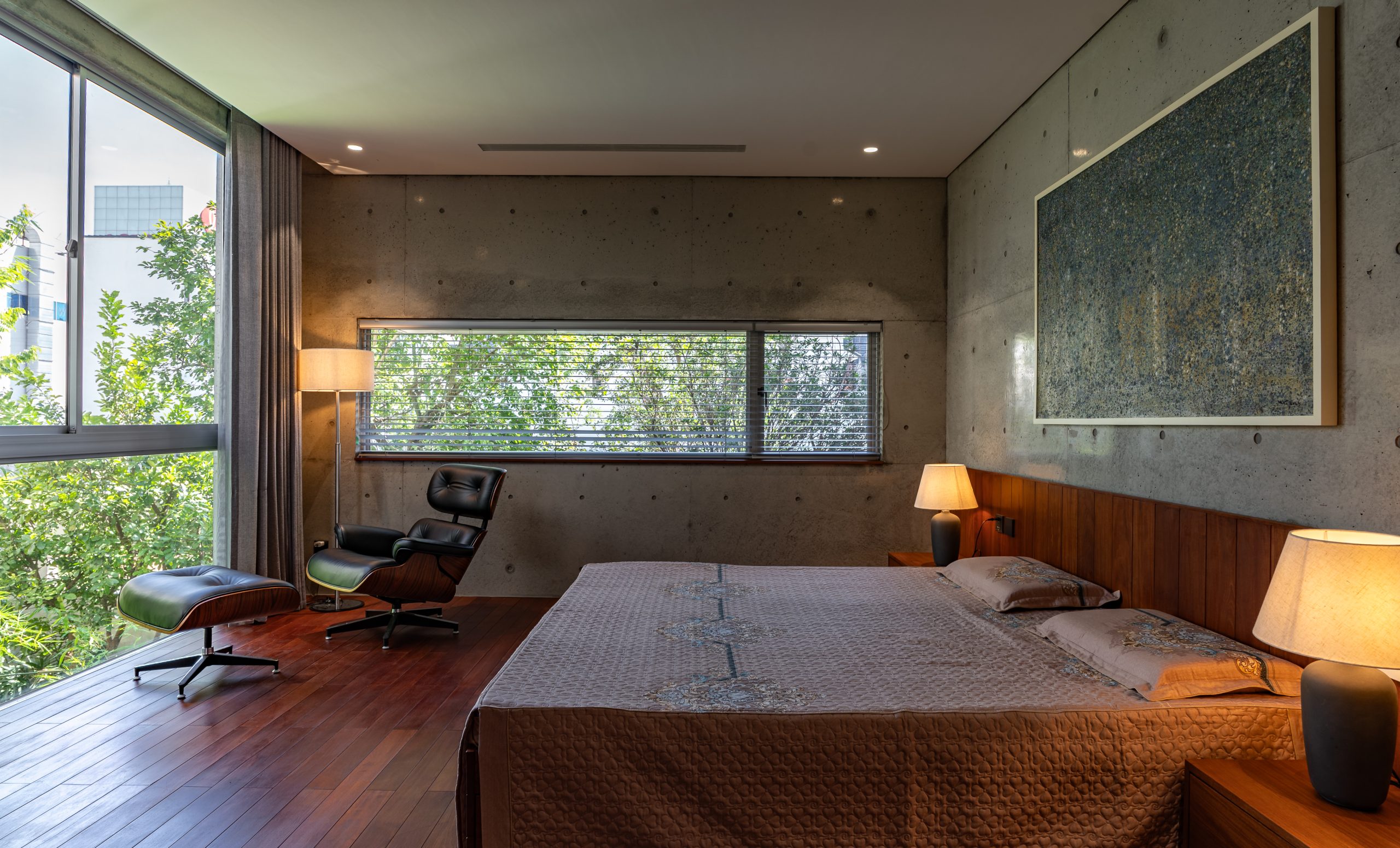 Bedroom opening towards a planted terrace, House K by HGAA