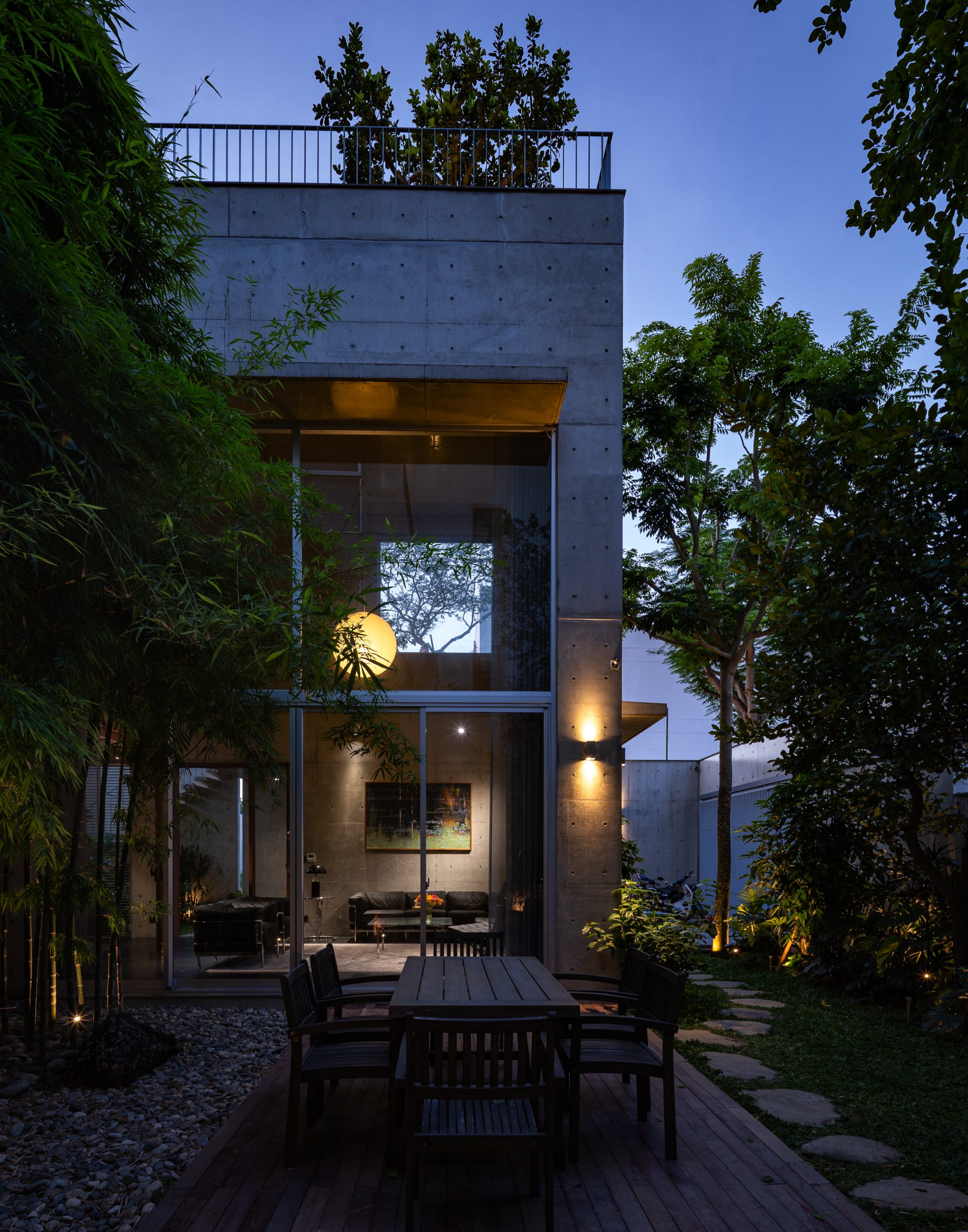 Illuminated courtyard walls and windows, House K by HGAA
