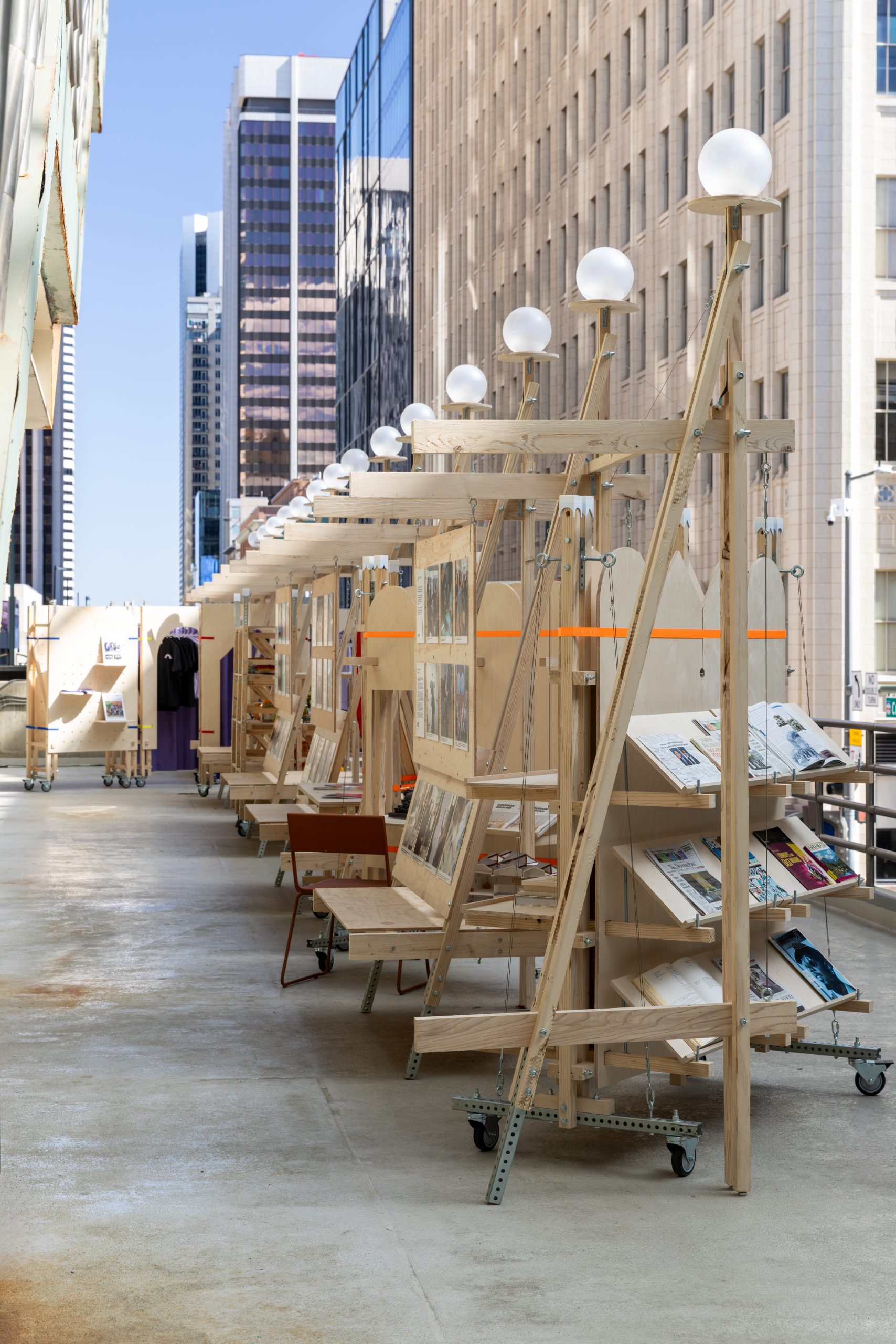 Mobile newspaper display stands within the timber framework, Parts of Common
