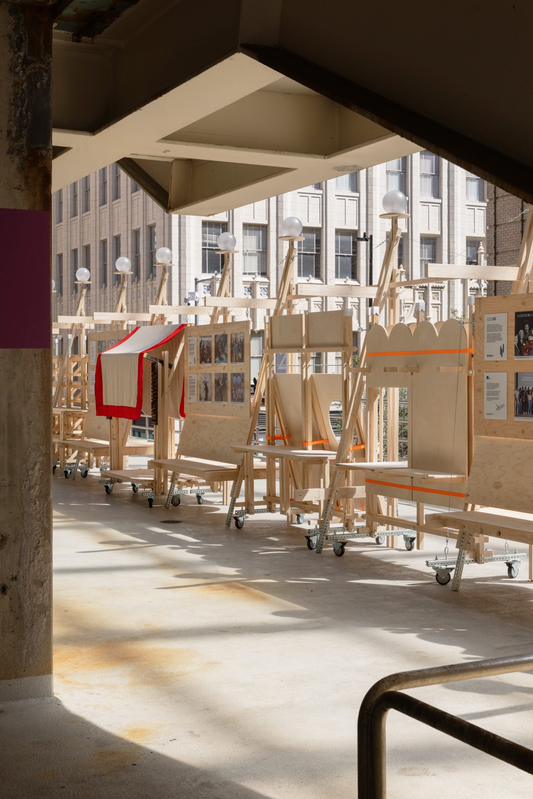Red-edged canopy within the row of timber structures, Parts of Common