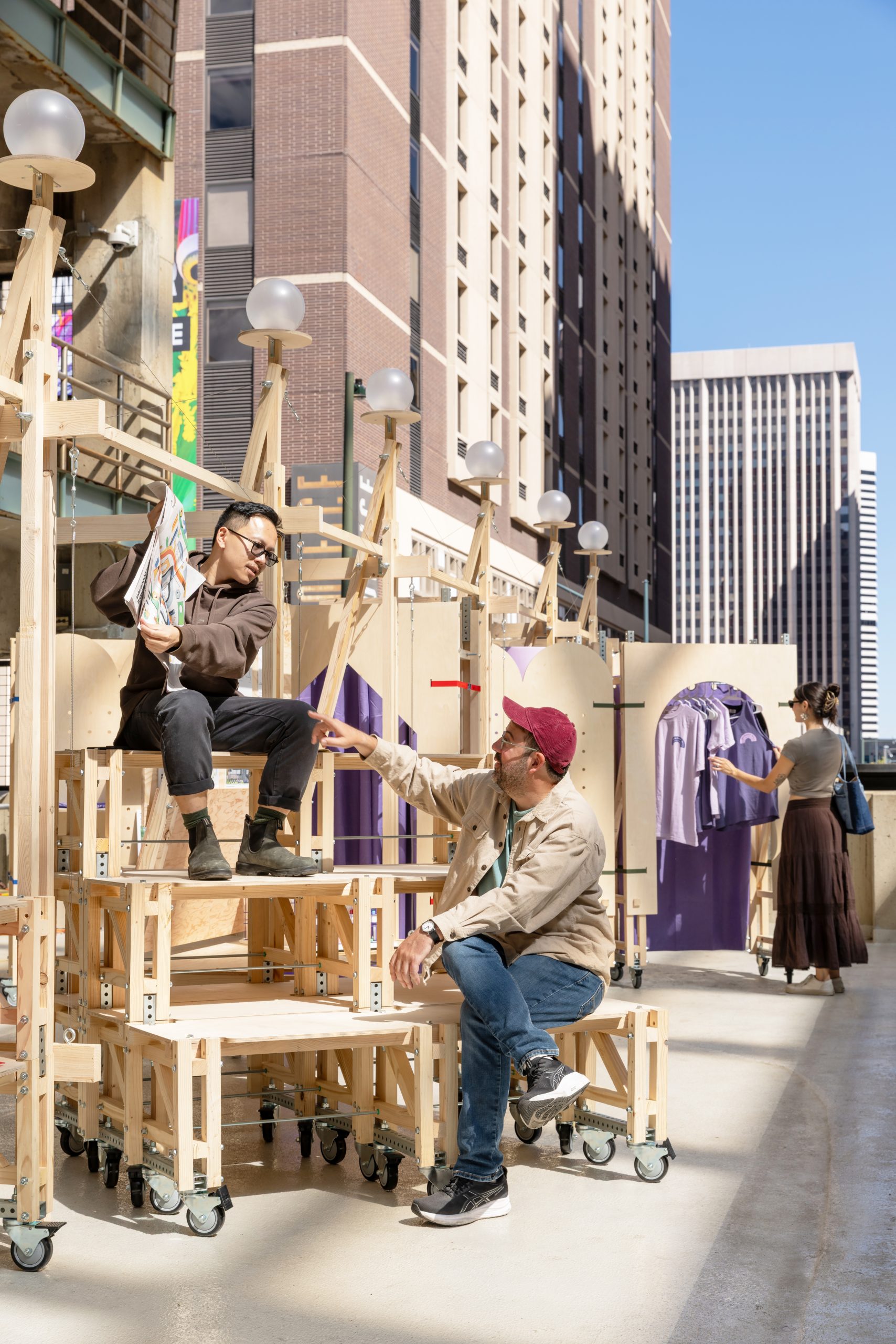 Visitors sitting on stackable timber benches, Parts of Common