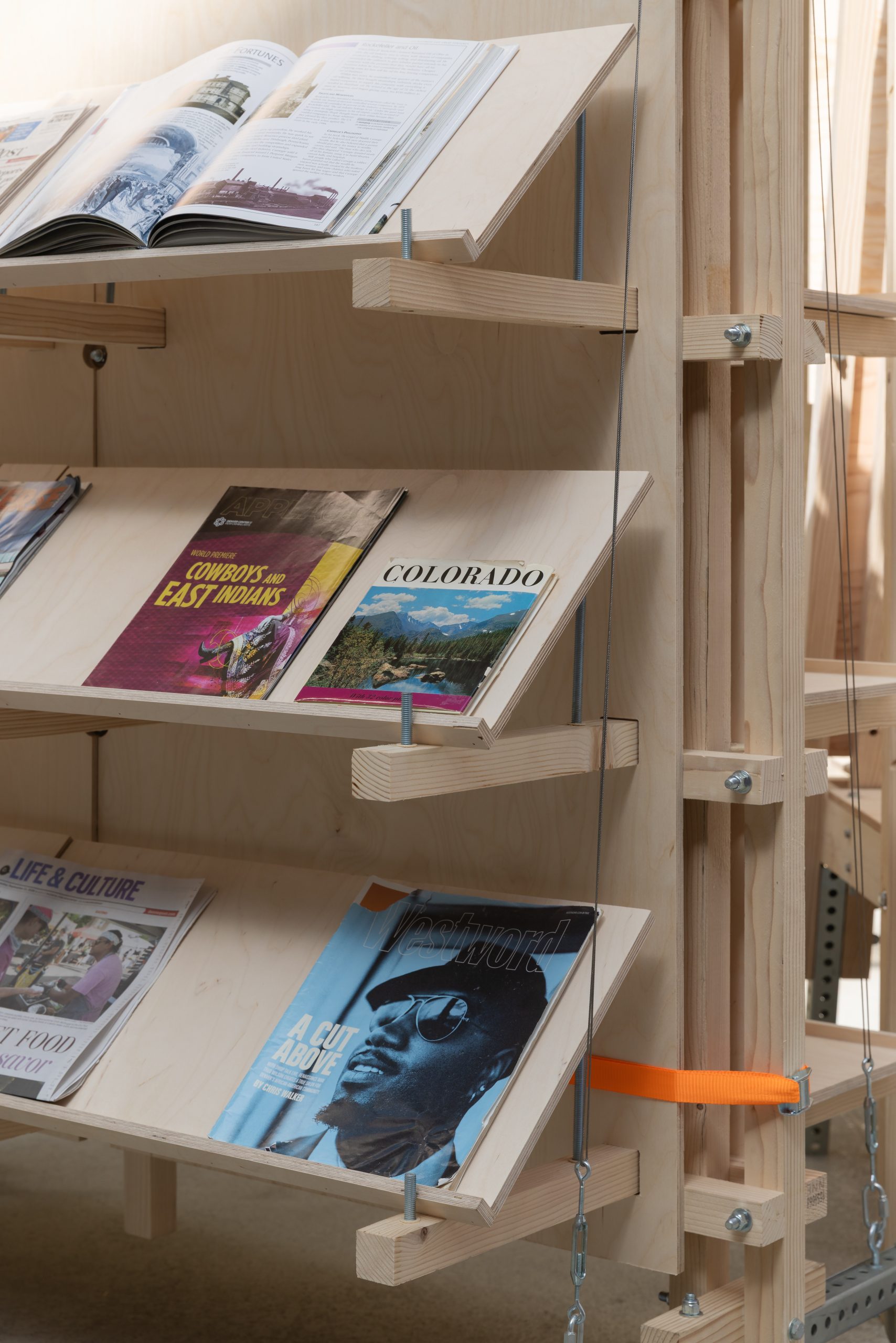 Newspapers displayed on angled timber shelves, Parts of Common