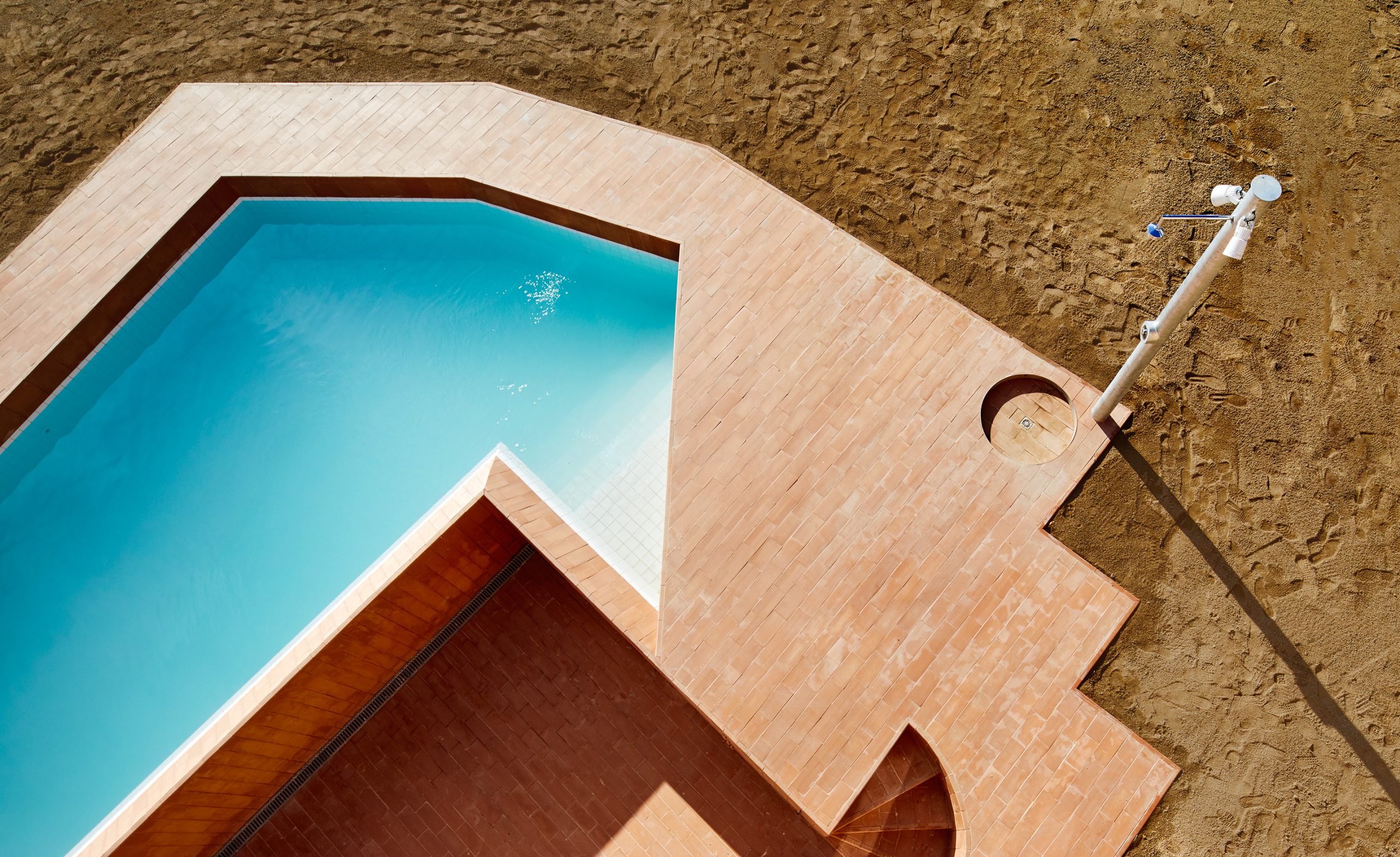 Angular pool beside the sunken terrace at Can Migris