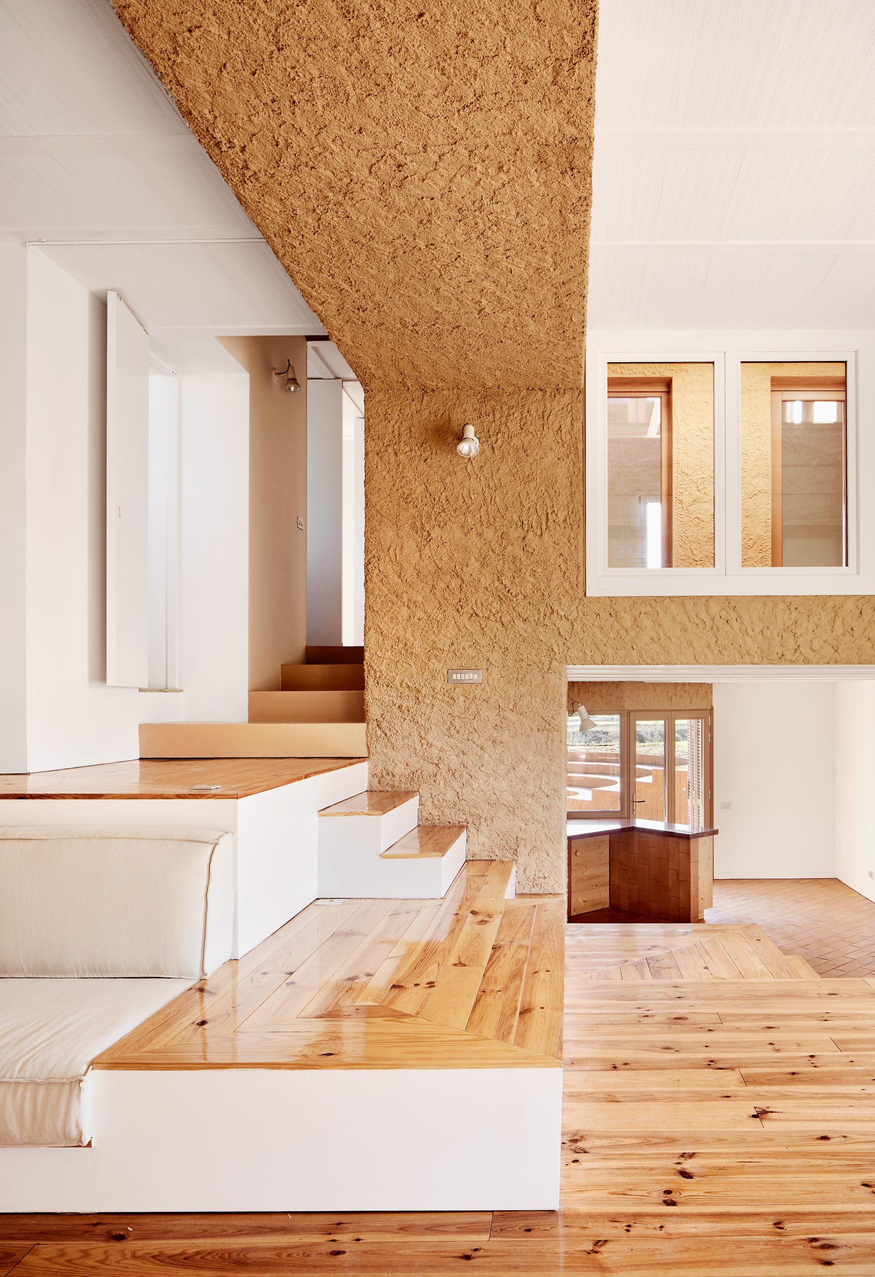 Staggered living spaces around the central core at Can Migris