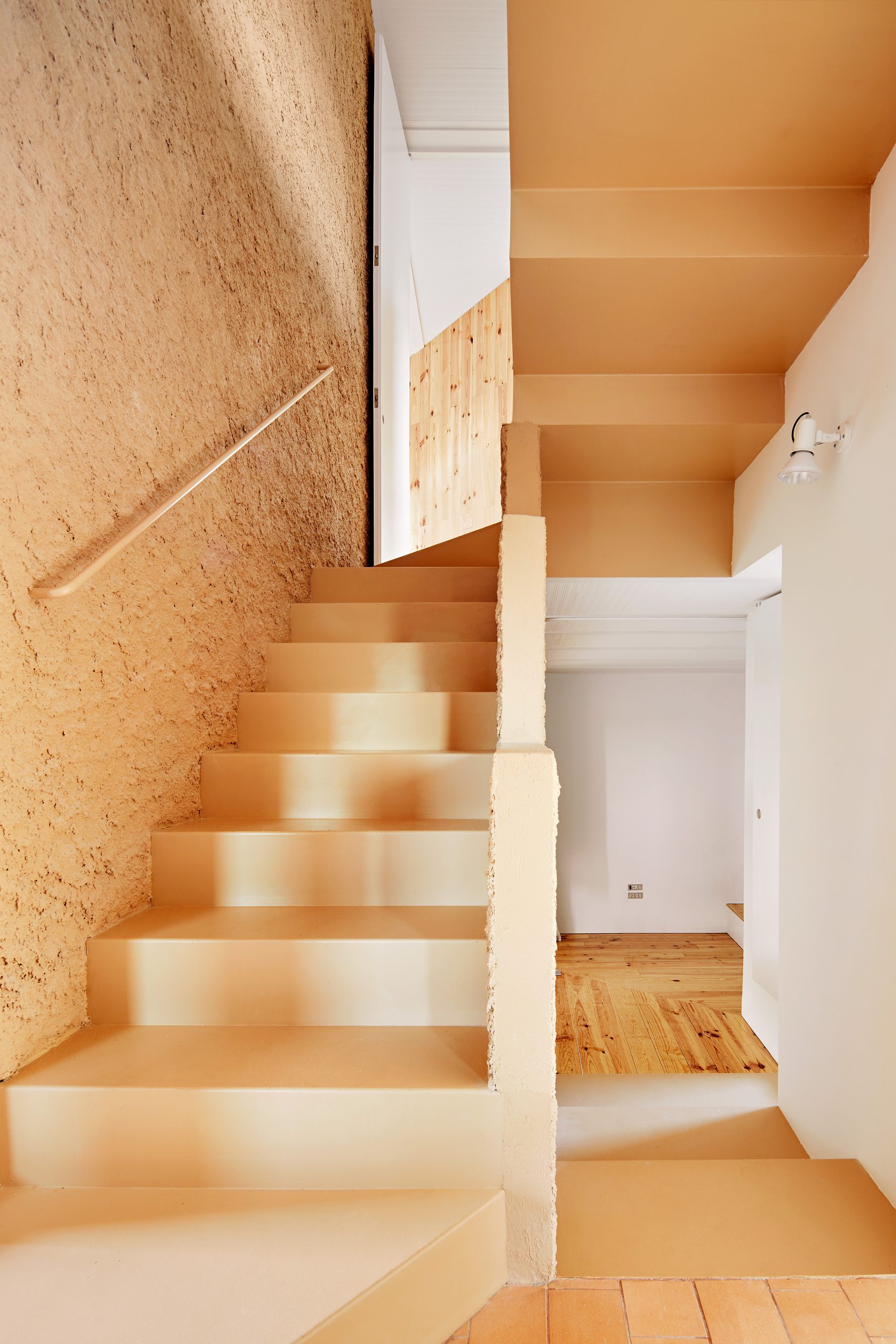 Staircase beside the rough central core at Can Migris