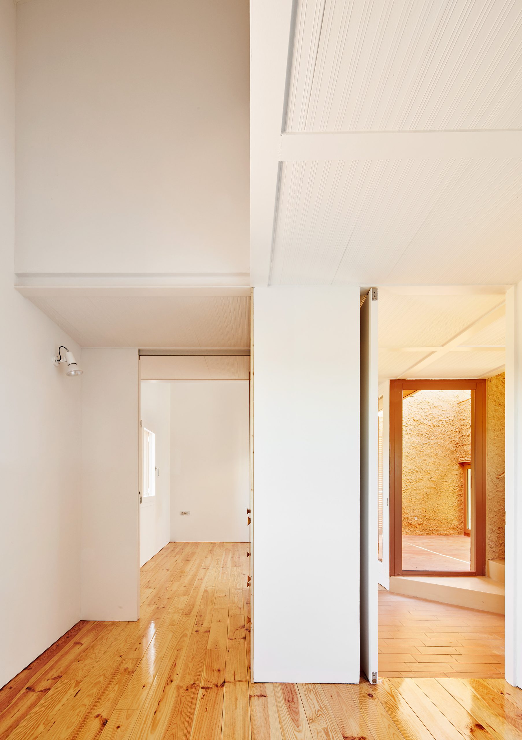 Upper-level rooms and timber floor at Can Migris