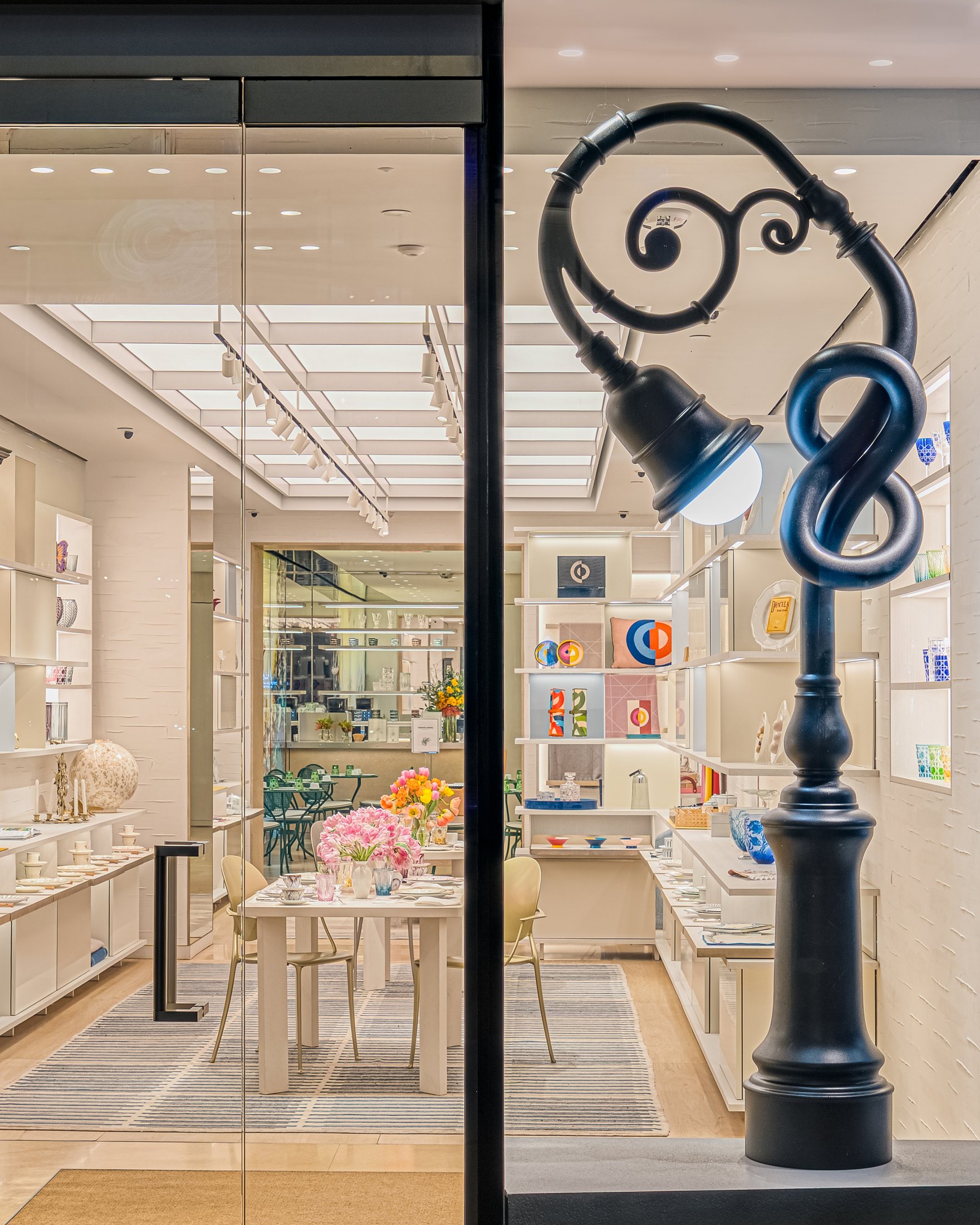 Curled ornamental street lamp in a New York Dior window