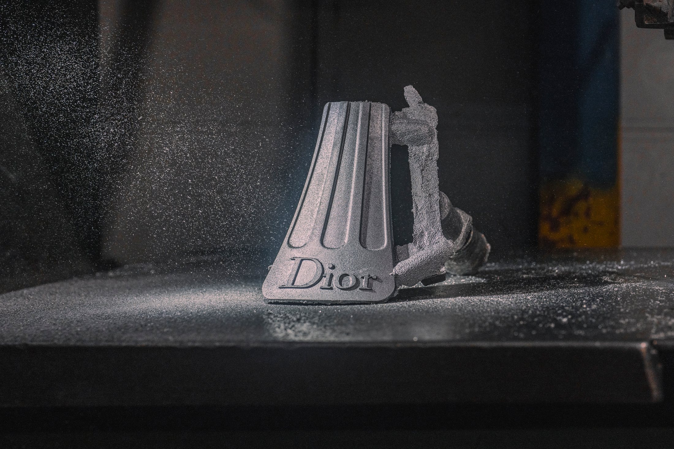 Dior-marked fluted base component during workshop production