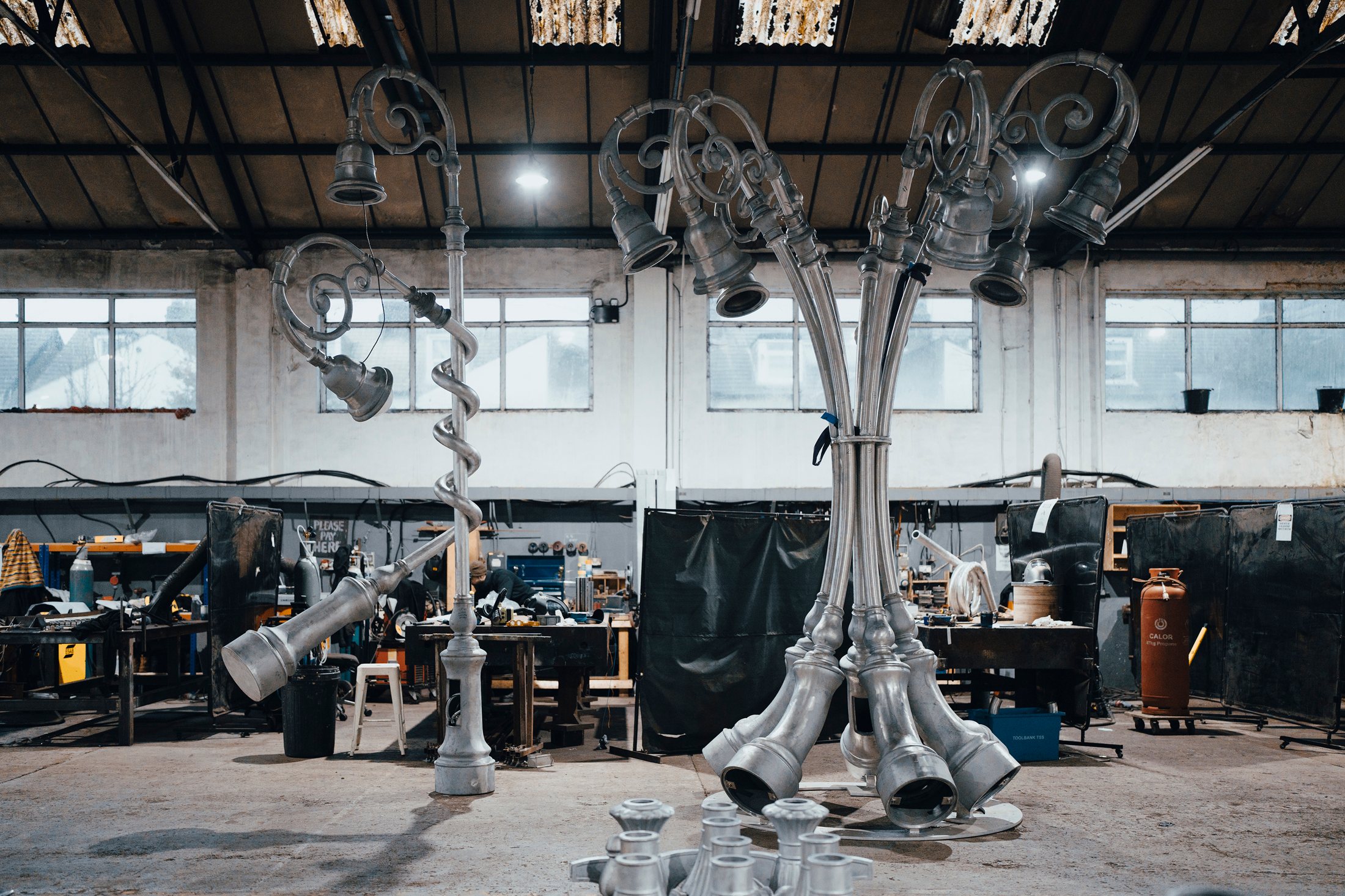 Unfinished ornamental lamp cluster in the fabrication workshop