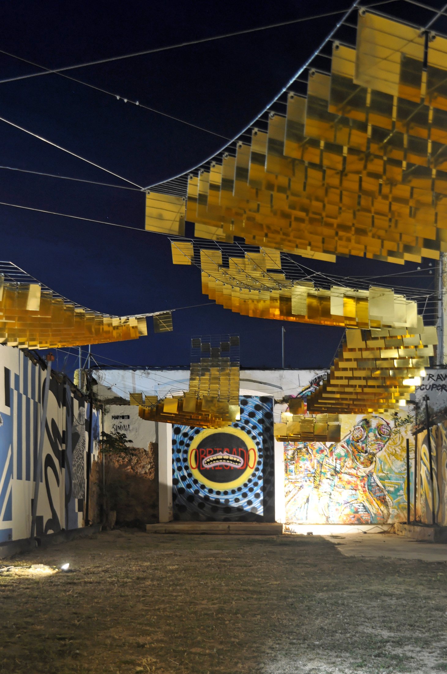 A-L-M-A-D-R-A-V-A illuminated at night at the festival entrance