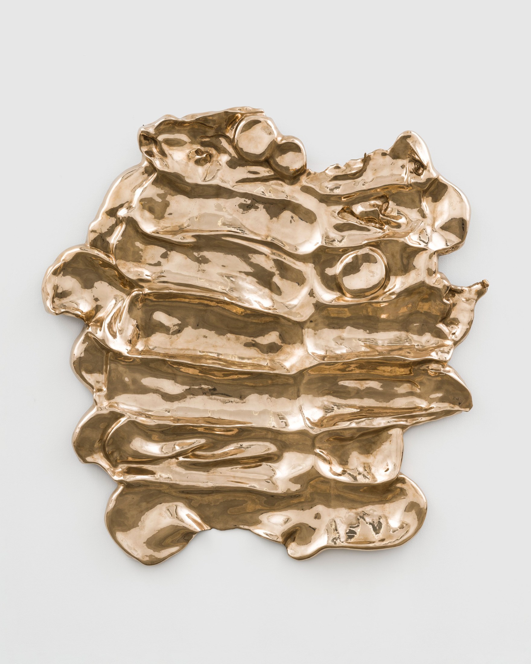 Alma Allen’s Not Yet Titled from 2022, a broad bronze relief with rippling horizontal ridges