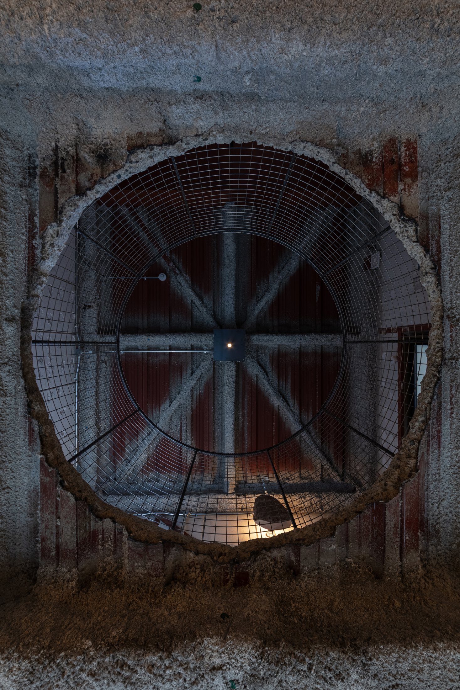 Circular opening linking the two floors of Maniwa