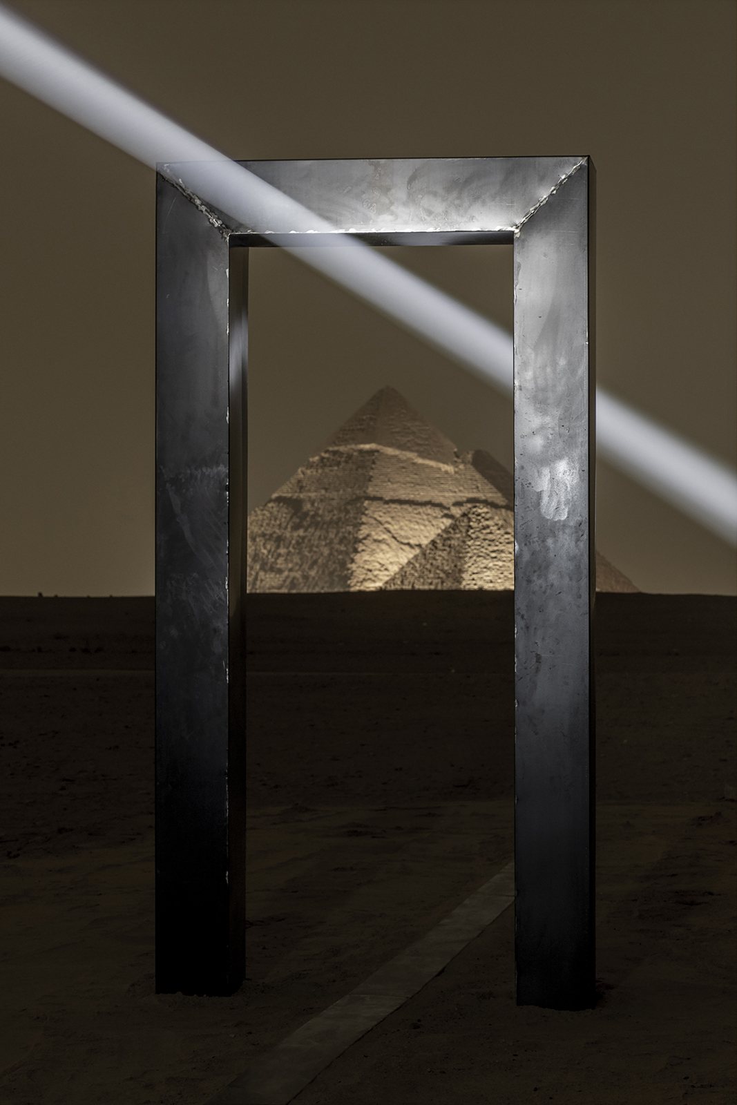 Metal portal framing a pyramid in Emilio Ferro’s Portal of Light