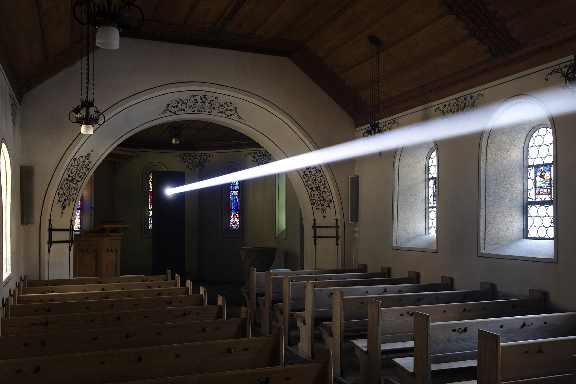 Liminal Journey light beam across the chapel interior