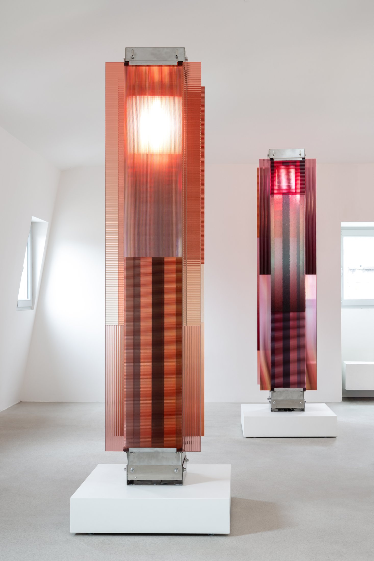 Moving light behind amber and rose glass in Garden of Hope at BOON_MONCEAU
